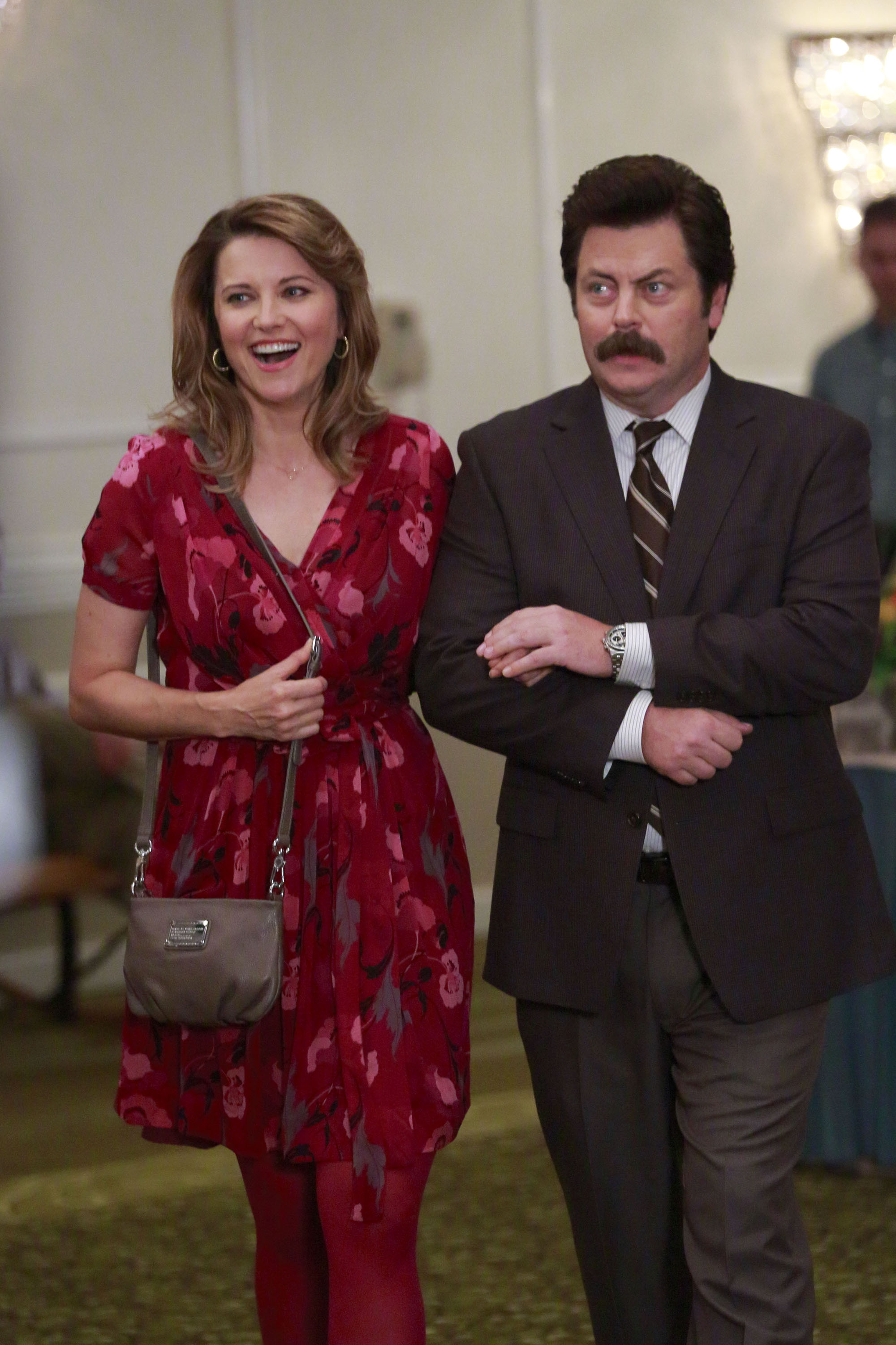 Lucy Lawless as Diane Lewis and Nick Offerman as Ron Swanson in "Parks and Recreation" on October 16, 2012 | Source: Getty Images