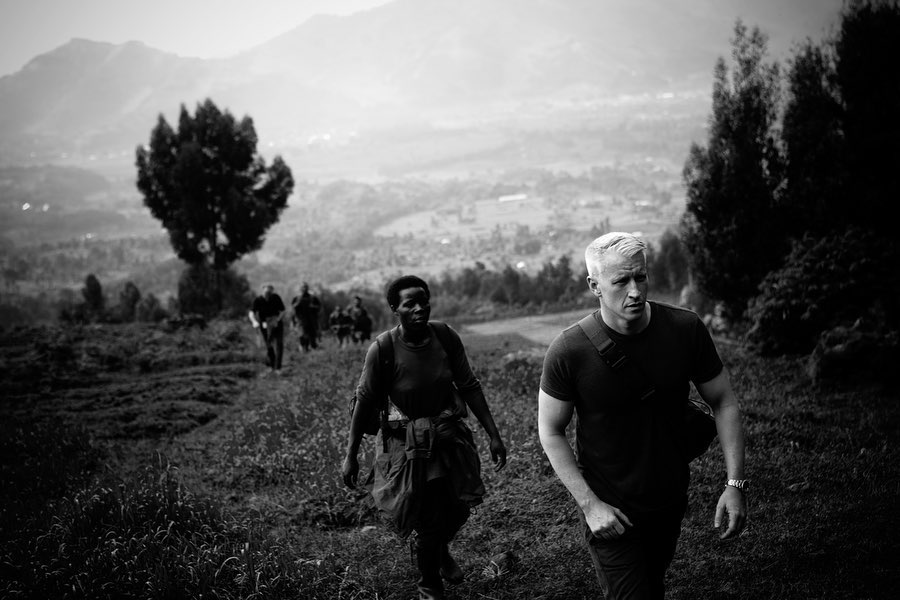 Anderson Cooper with an interviewee while on a reporting trip to Rwanda, Africa, for CNN's "Planet in Peril: Battle Lines," from an Instagram post dated January 24, 2020 | Source: Instagram/andersoncooper360/