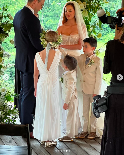 Ian Hock and Eva Amurri with Marlowe Mae, Major James, and Mateo Antoni Martino participating in the handfasting tradition, posted on July 1, 2024 | Source: Instagram/marcus.mcgregor