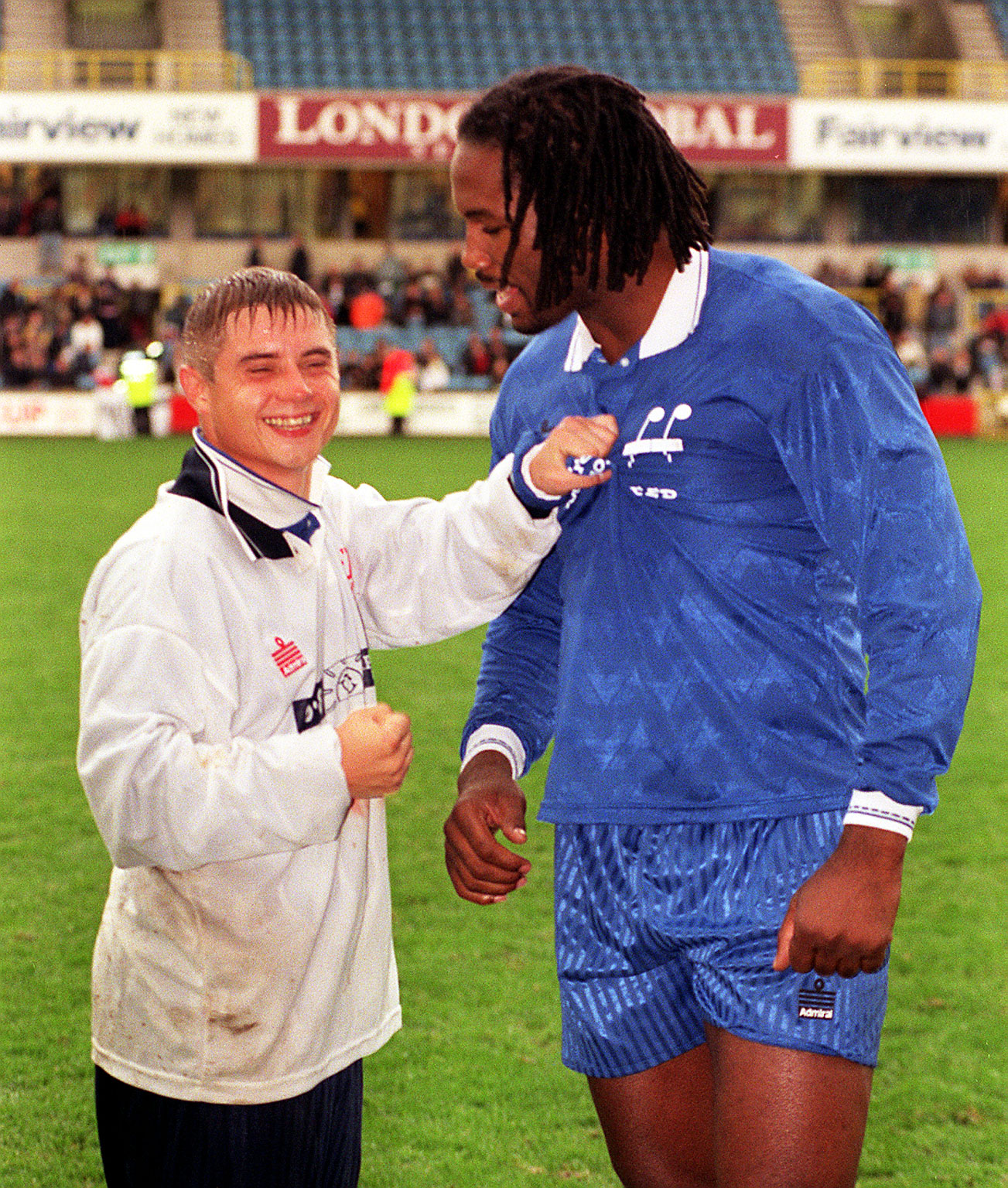John Alford makes a late challenge on former world heavyweight boxing champion Lennox Lewis after the Stars Cup charity football match at Millwall's new Den ground on 17 November 1996. | Source: Getty Images