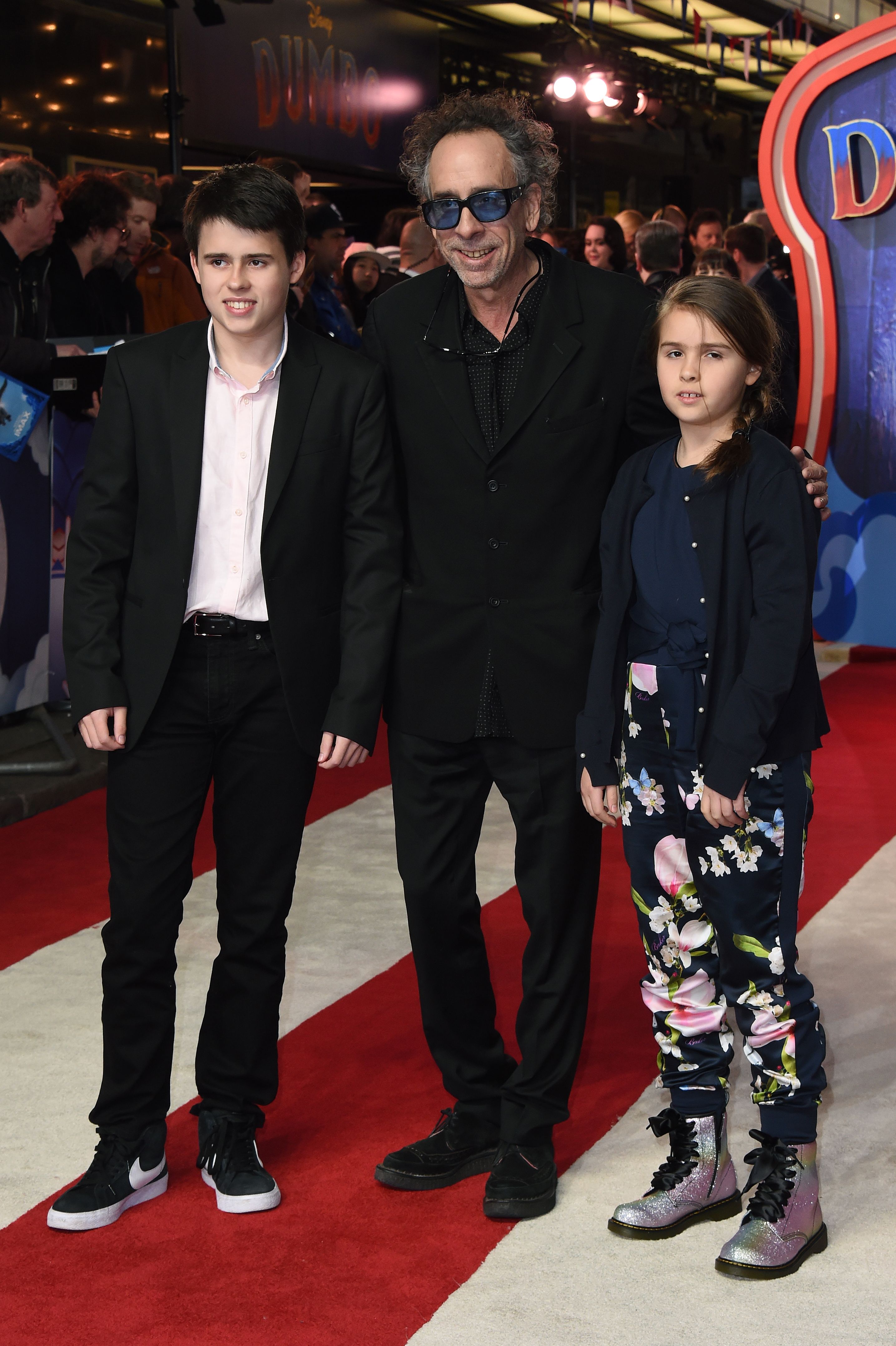 Tim Burton, Billy Burton, and Nell Burton during the "Dumbo" European premiere at The Curzon Mayfair on March 21, 2019, in London, England. | Source: Getty Images