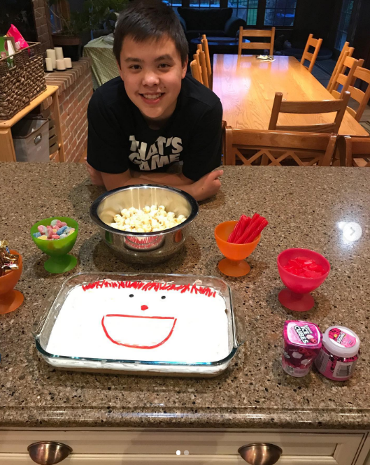 Joel stayed focused on his academic goals and was set to graduate in 2027. On this occasion, he posed with a cake at home on May 13, 2019. | Source: Instagram/kateplusmy8