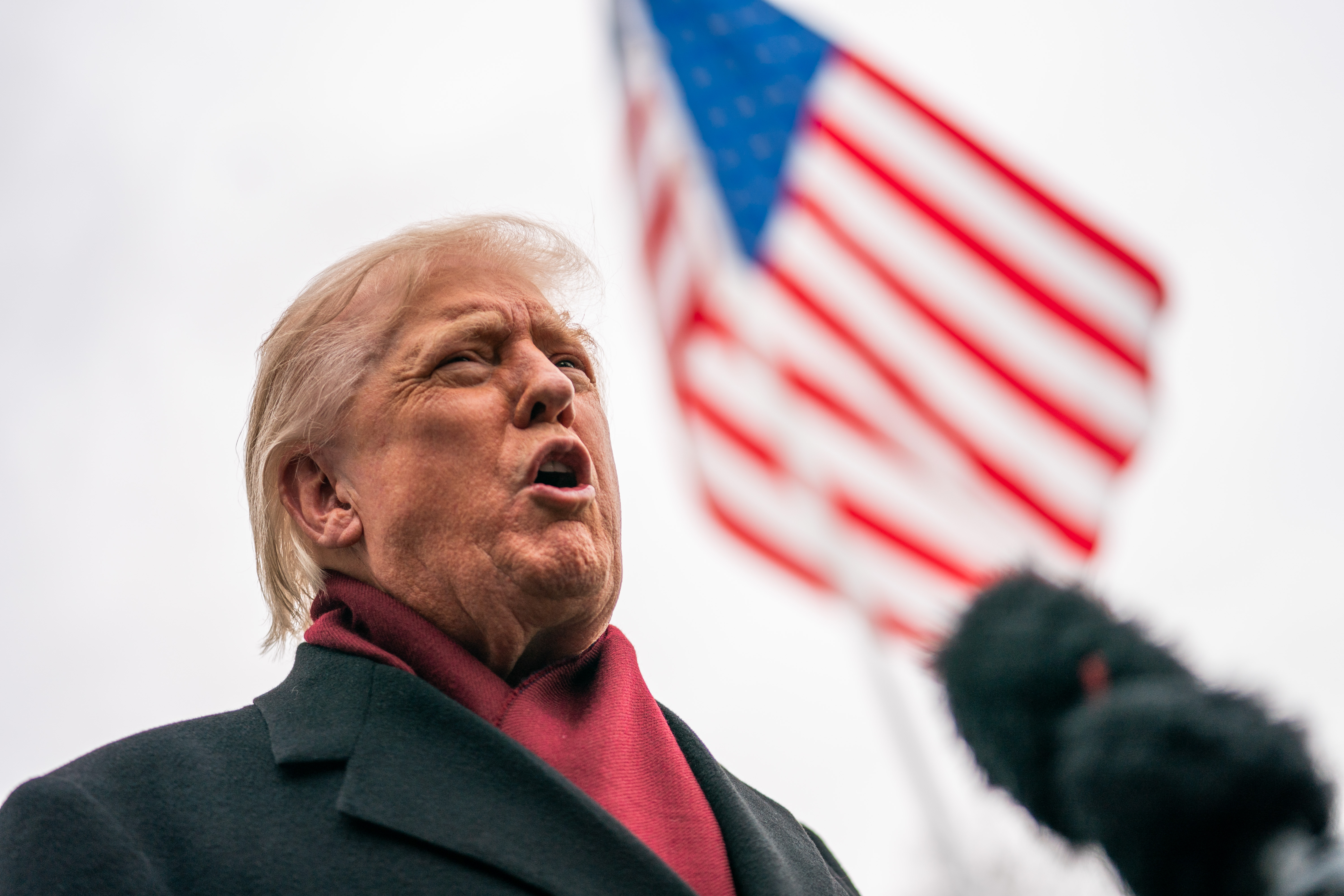 President Donald Trump speaks to members of the press before departing the White House on Marine One in Washington, D.C., on November 22, 2025. | Source: Getty Images