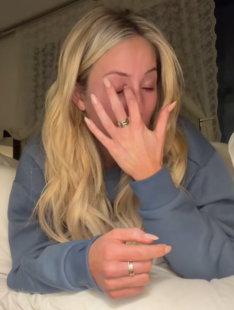 Alix Earle wipes her eyes as she gets emotional, from a post dated December 14, 2025. | Source: TikTok/alixearle