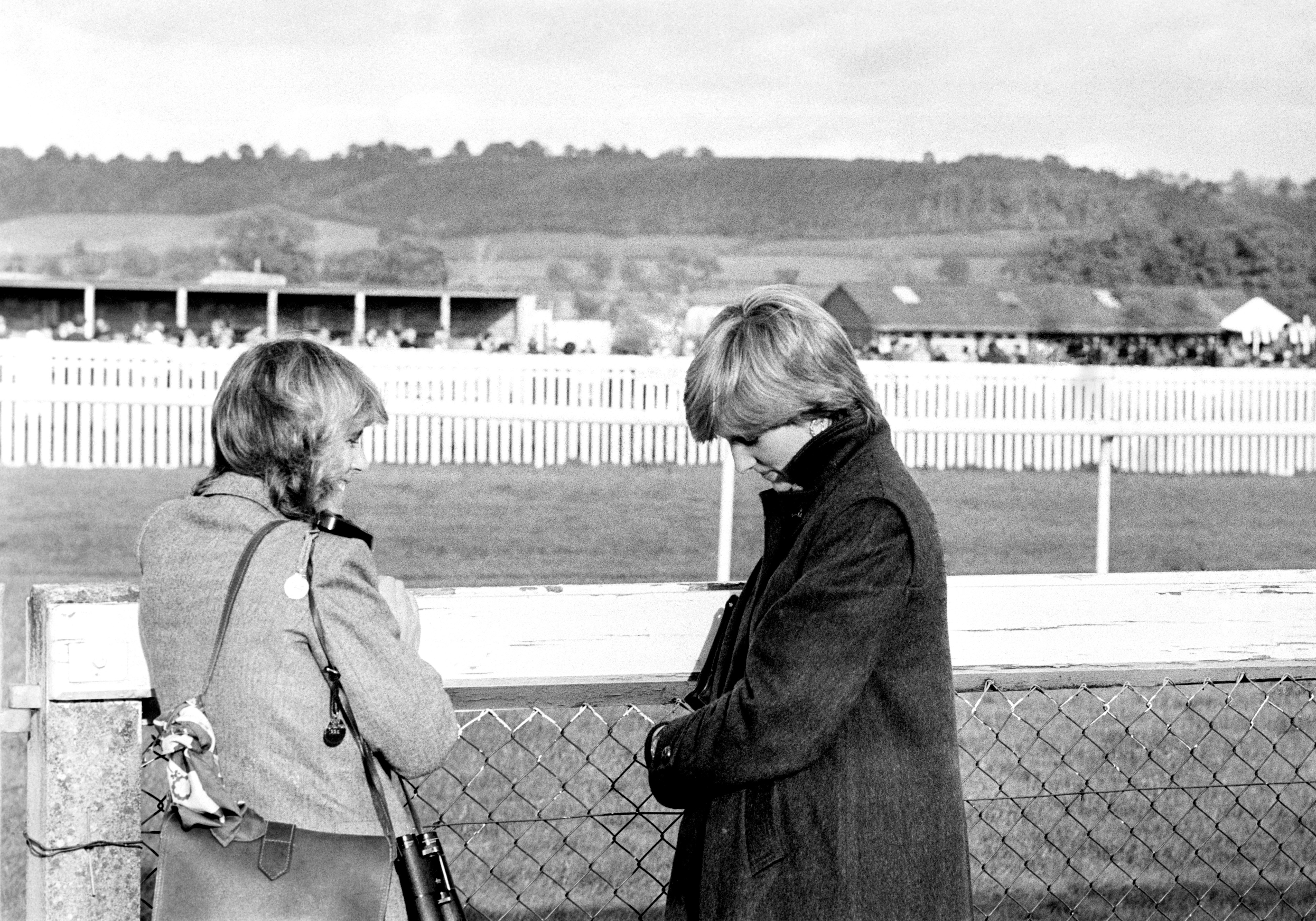 Camilla Parker-Bowles (left) and Lady Diana Spencer (later the Princess of Wales) at Ludlow racecourse in which the Prince was competing. | Photo: Getty Images 