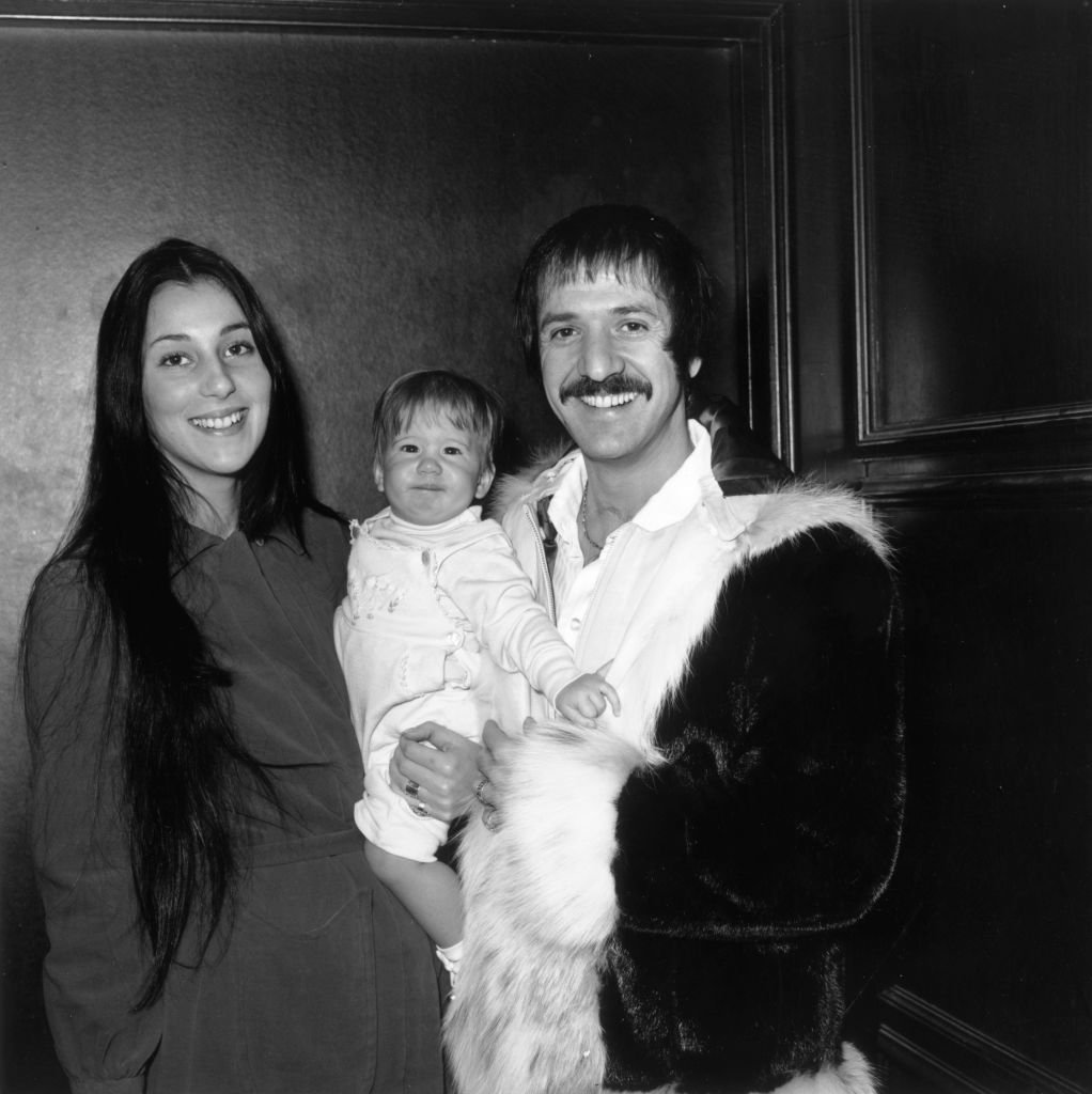 Sonny and Cher smiling and holding their infant daughter Chastity at Zsa Zsa Gabor's opening at "The Flamingo," Las Vegas, Nevada | Photo: Getty Images