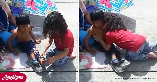 Heartwarming moment 2-year-old boy gives his shoes and socks to homeless boy