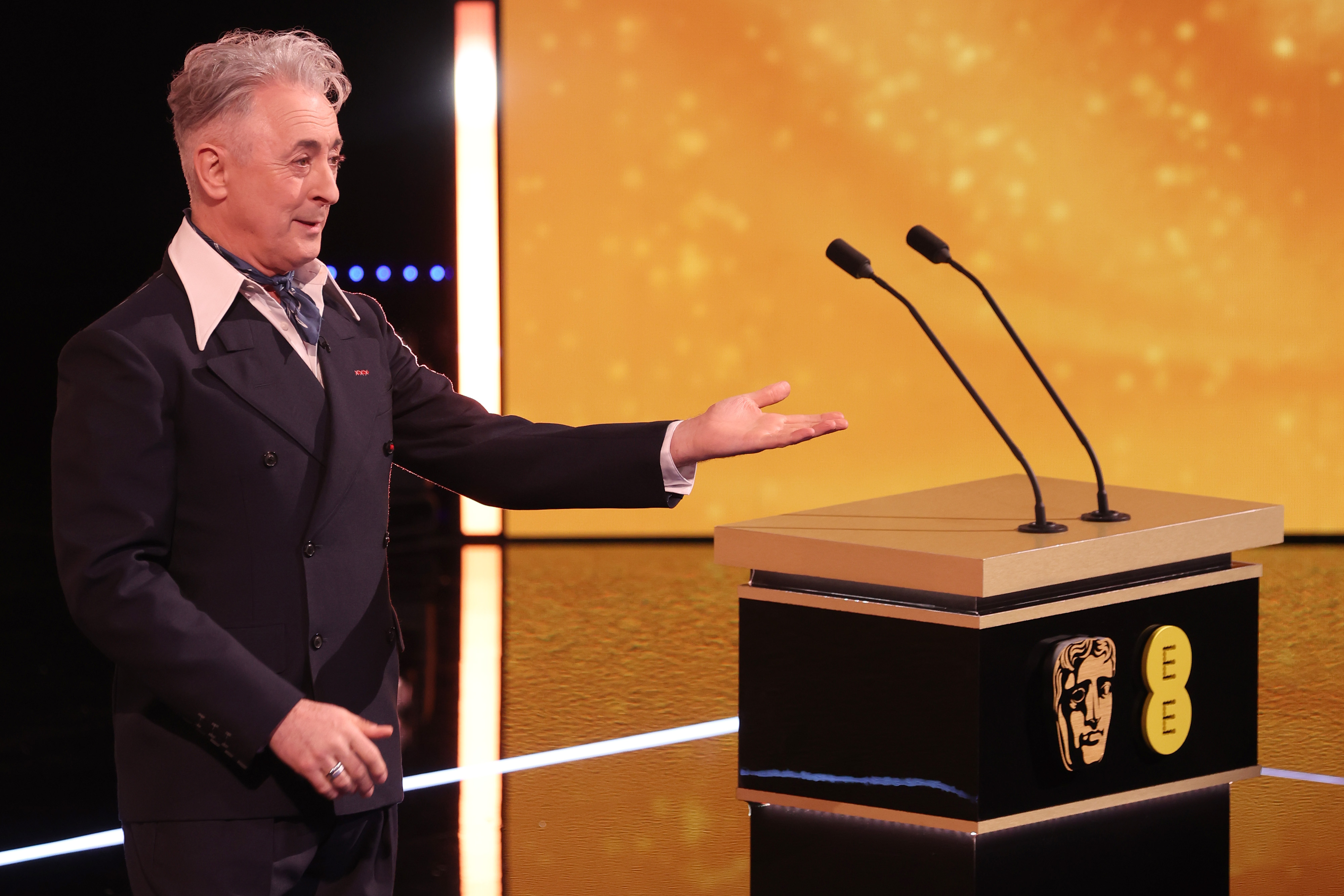 Alan Cumming speaks on stage during the 2026 EE BAFTA Awards on February 22 in London, England. | Source: Getty Images