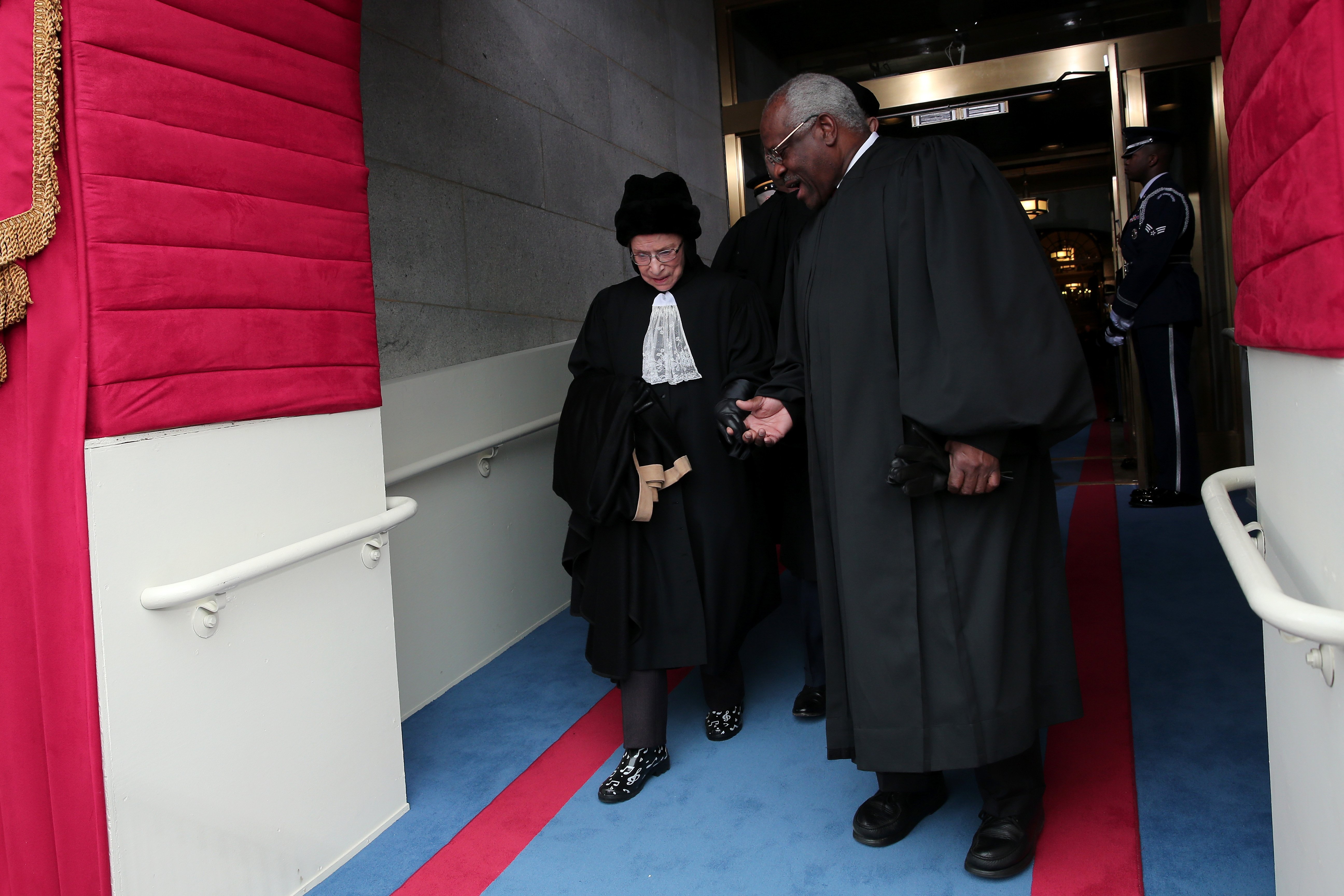 Justice Ruth Bader Ginsburg and Justice Clarence Thomas arriving at the presidential inauguration in Washington, DC | Source: Getty Images