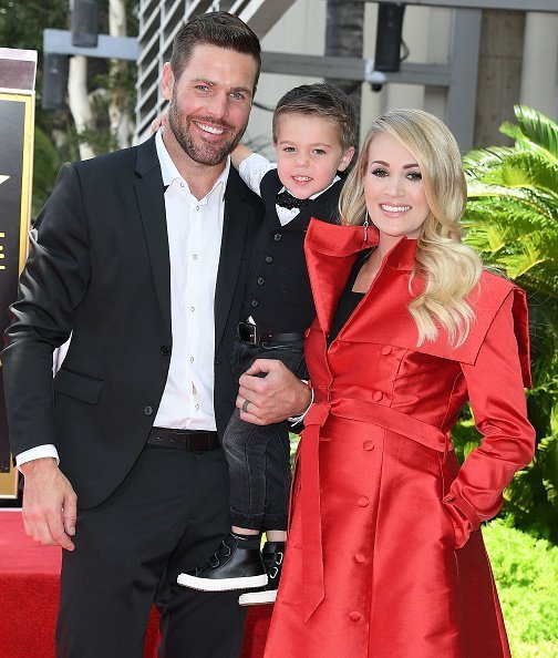  Mike Fisher, Isaiah Michael Fisher and Carrie Underwood in Hollywood, California | Photo: Getty Images