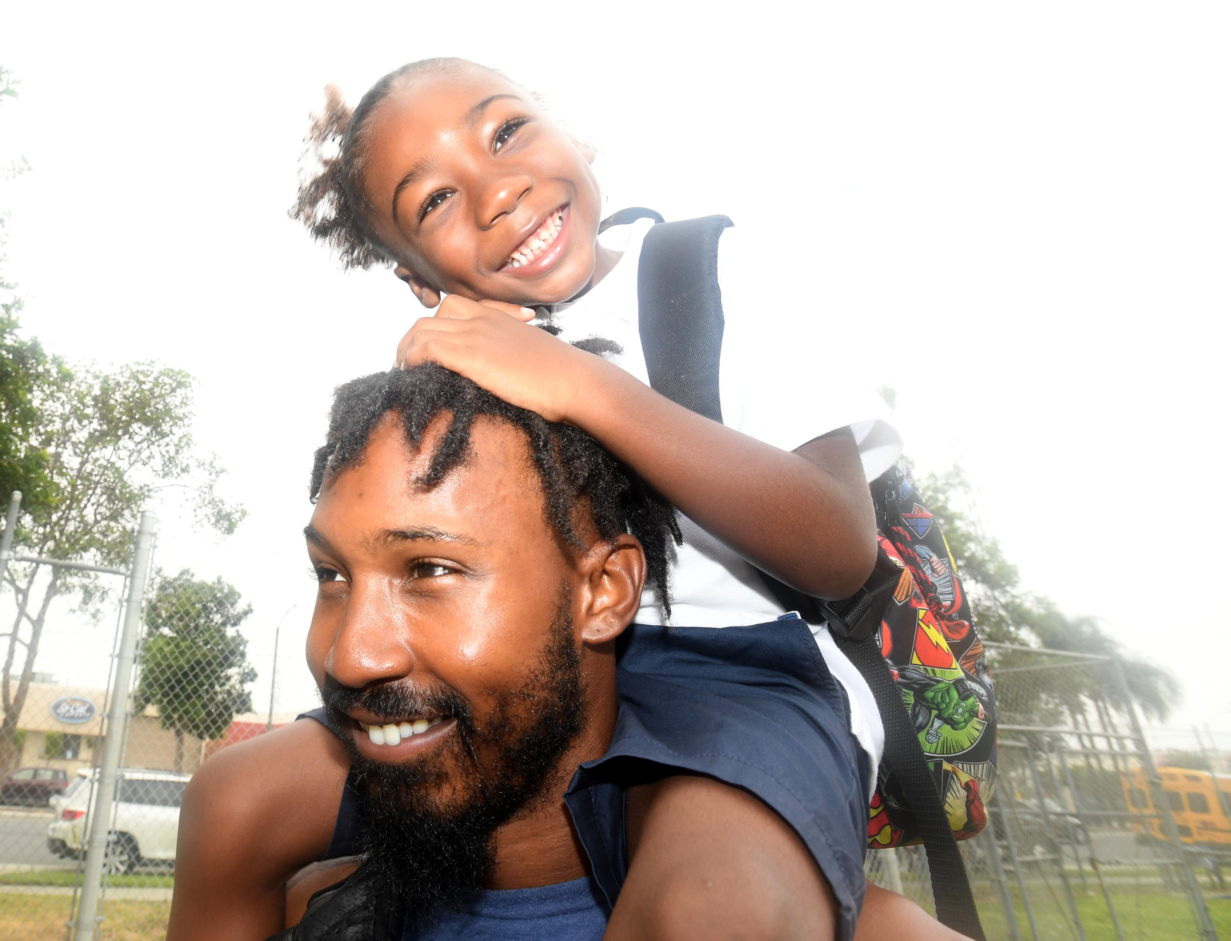 Kal-El Mulkey-Hiriams is all smiles on his dads shoulders and ready for the first day of kindergarten at McKinley Elementary School in Long Beach on Wednesday, August 28, 2019.|Photo: Getty Images
