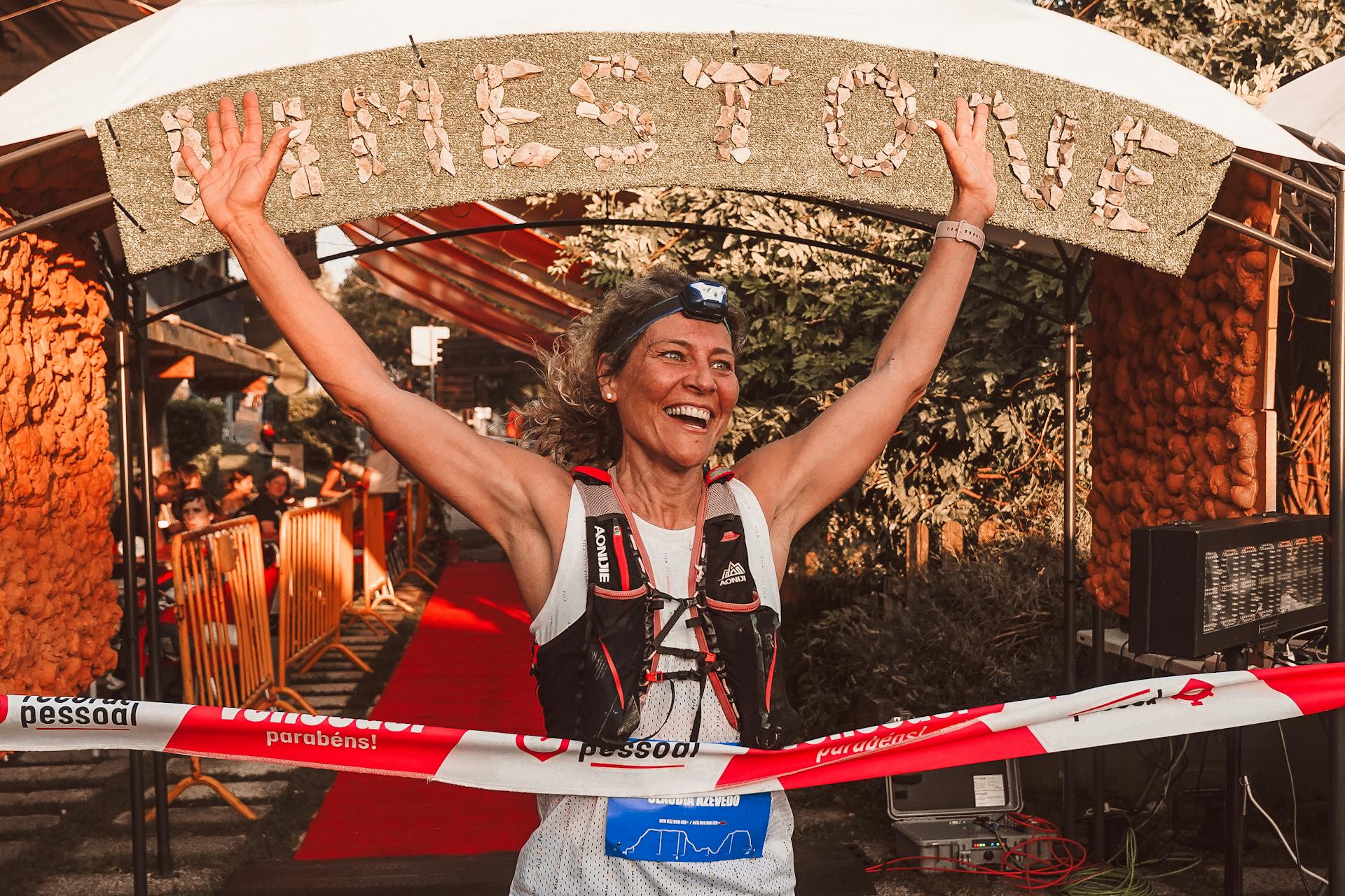 A female athlete crossing a marathon finish line | Source: Pexels