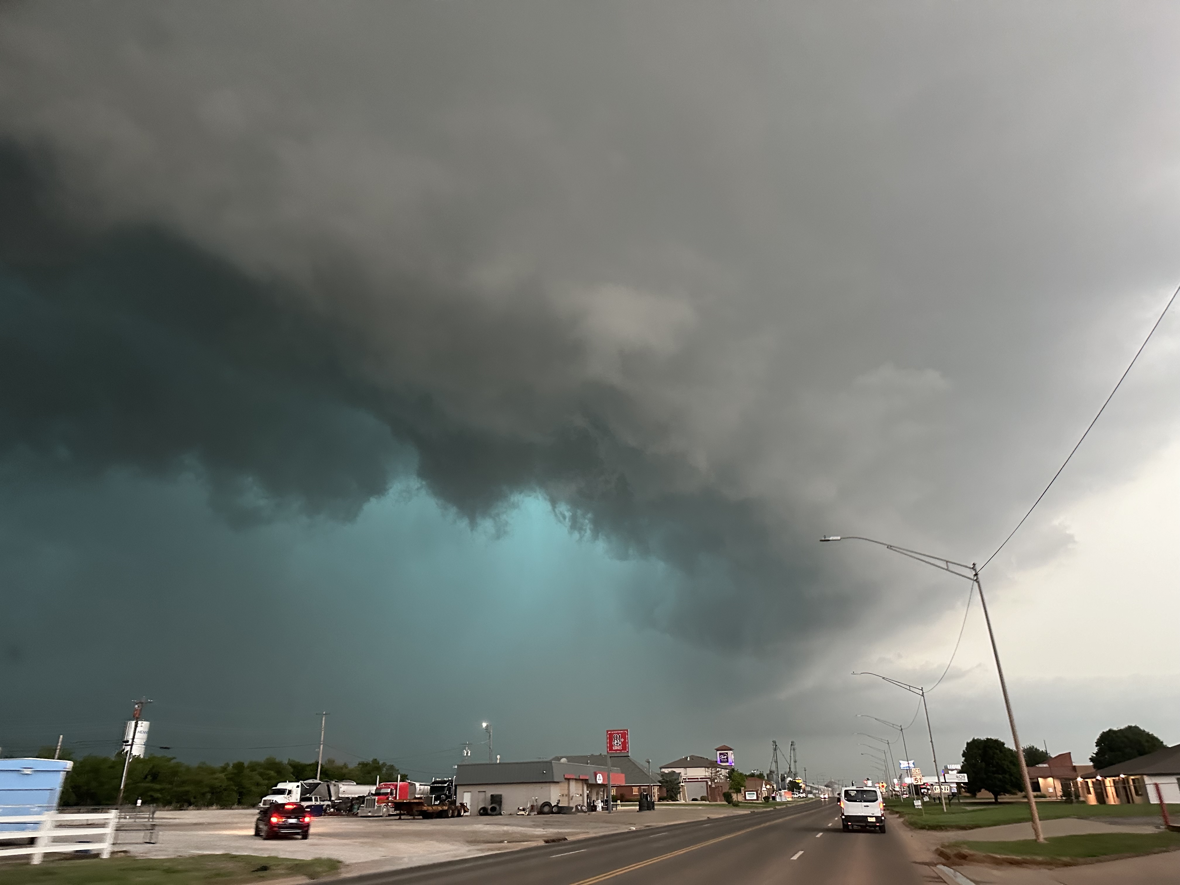 A mesocyclone and green glow from large hail appear as a tornadic supercell arrives in Hennessey, Oklahoma, on May 7, 2024 | Source: Getty Images