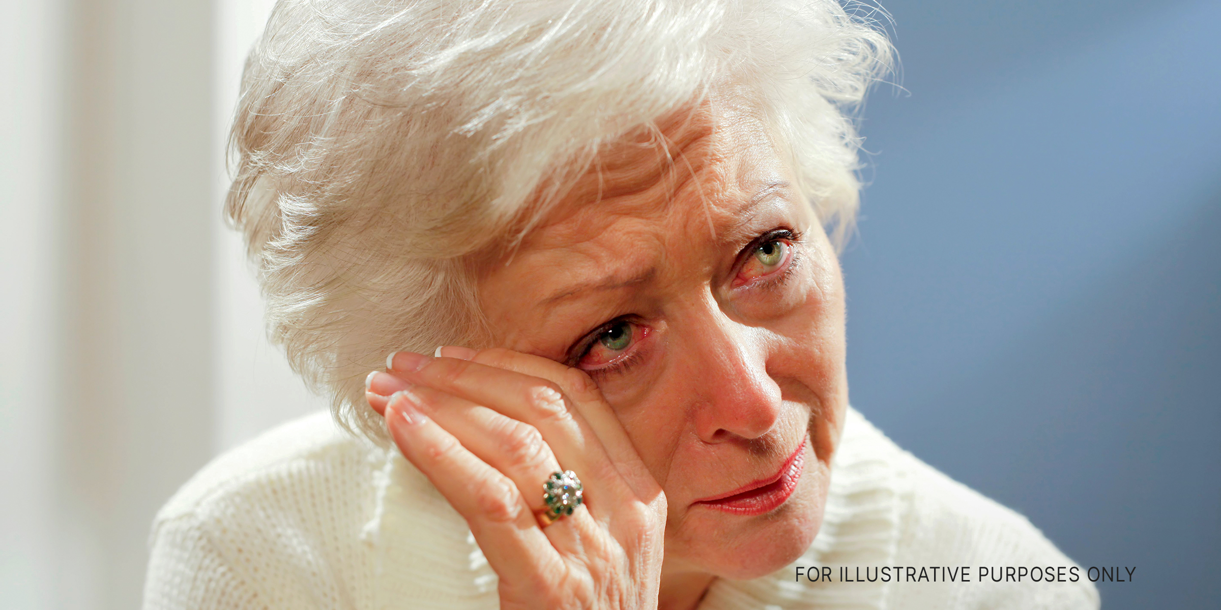 An elderly woman wiping away tears | Source: Getty Images