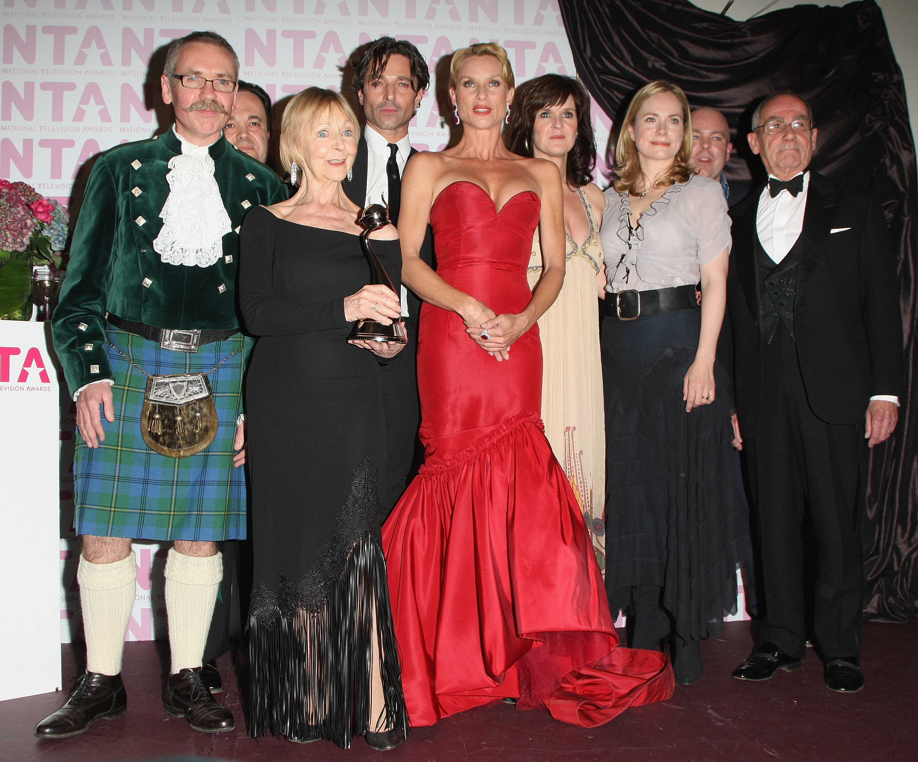Nicollette Sheridan (centre) poses with Sheila Reid (2nd L), Jake Canuso (4th L), Siobhan Finneran and cast members of "Benidorm", winner of Most Popular Comedy Programme award, during the National Television Awards 2008 at the Royal Albert Hall on 29 October in London, England. | Source: Getty Images