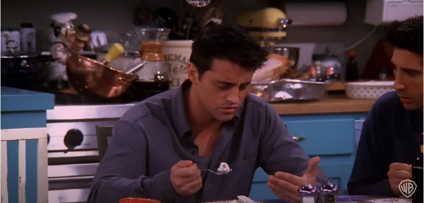 Matt LeBlanc as Joey on the set of "Friends" having dessert | Source: YouTube/@warnerbrostv