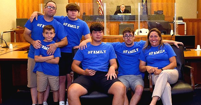 A photo of Nate and his new family is taken in court after the process was made official | Photo: Twitter/Beccah6abc