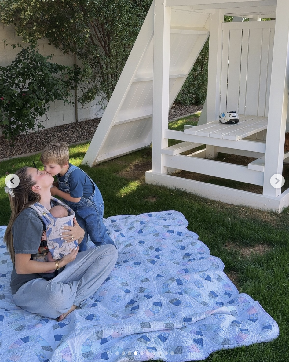 Emilie Kiser is seen with her newborn baby, Theodore, and her son Trigg, in a photo shared on May 13, 2025 | Source: Instagram/emiliekiser
