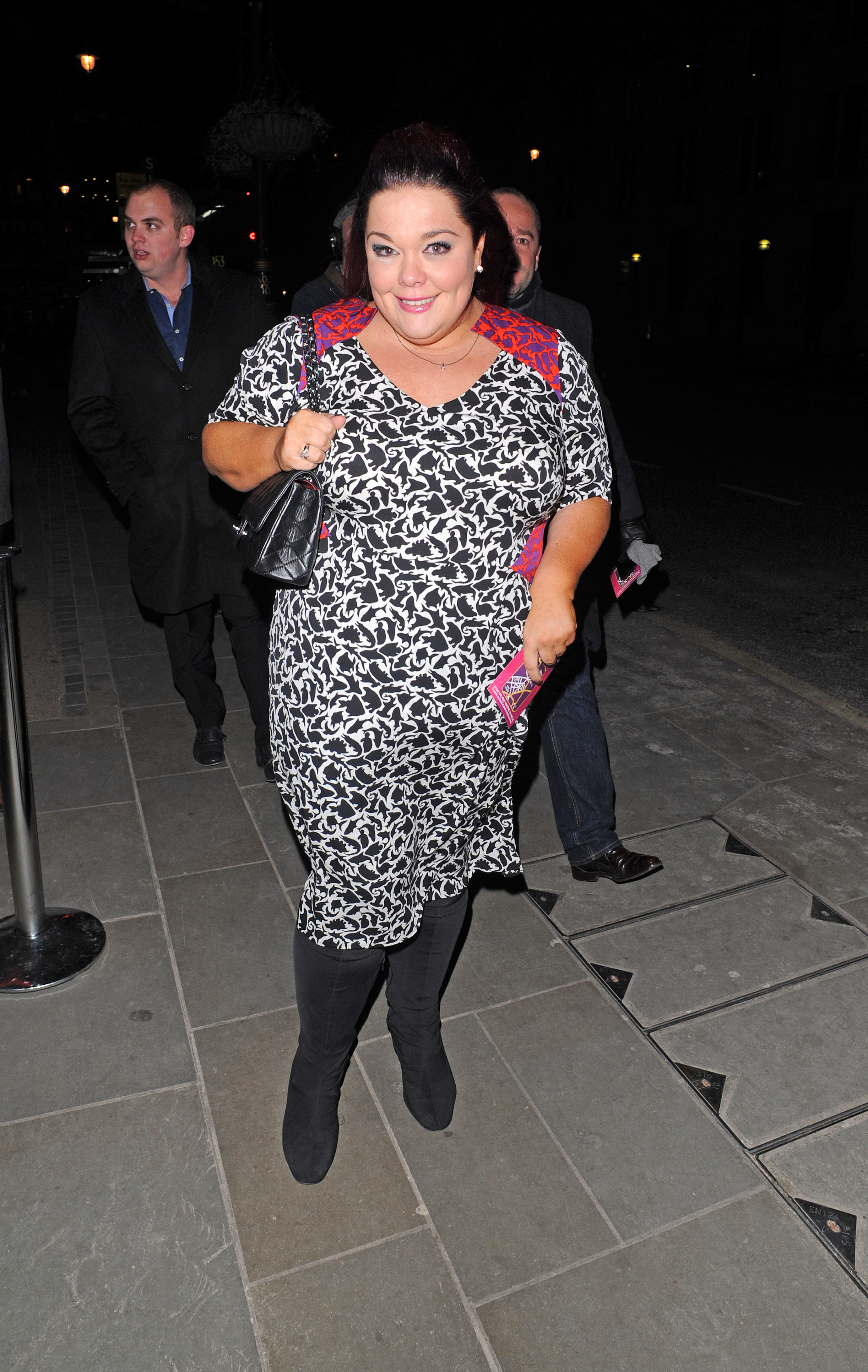 Bold and beaming! Riley is spotted stepping out at London's Trafalgar Hotel on 11 March 2013, turning heads in a dramatic black-and-white print dress and sleek black boots during her evening arrival.