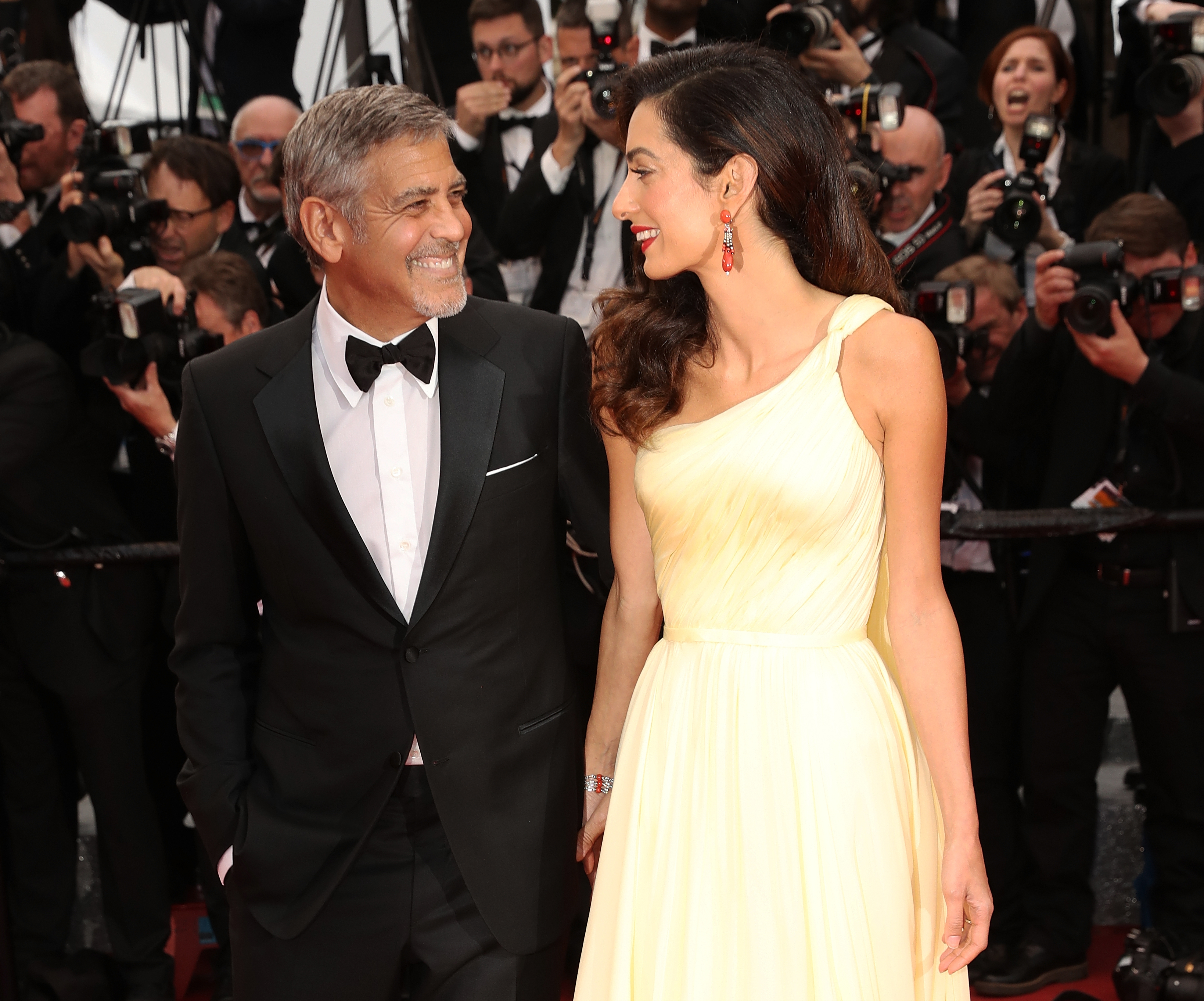 Amal Clooney and George Clooney in Cannes, France on May 12, 2015 | Source: Getty Images