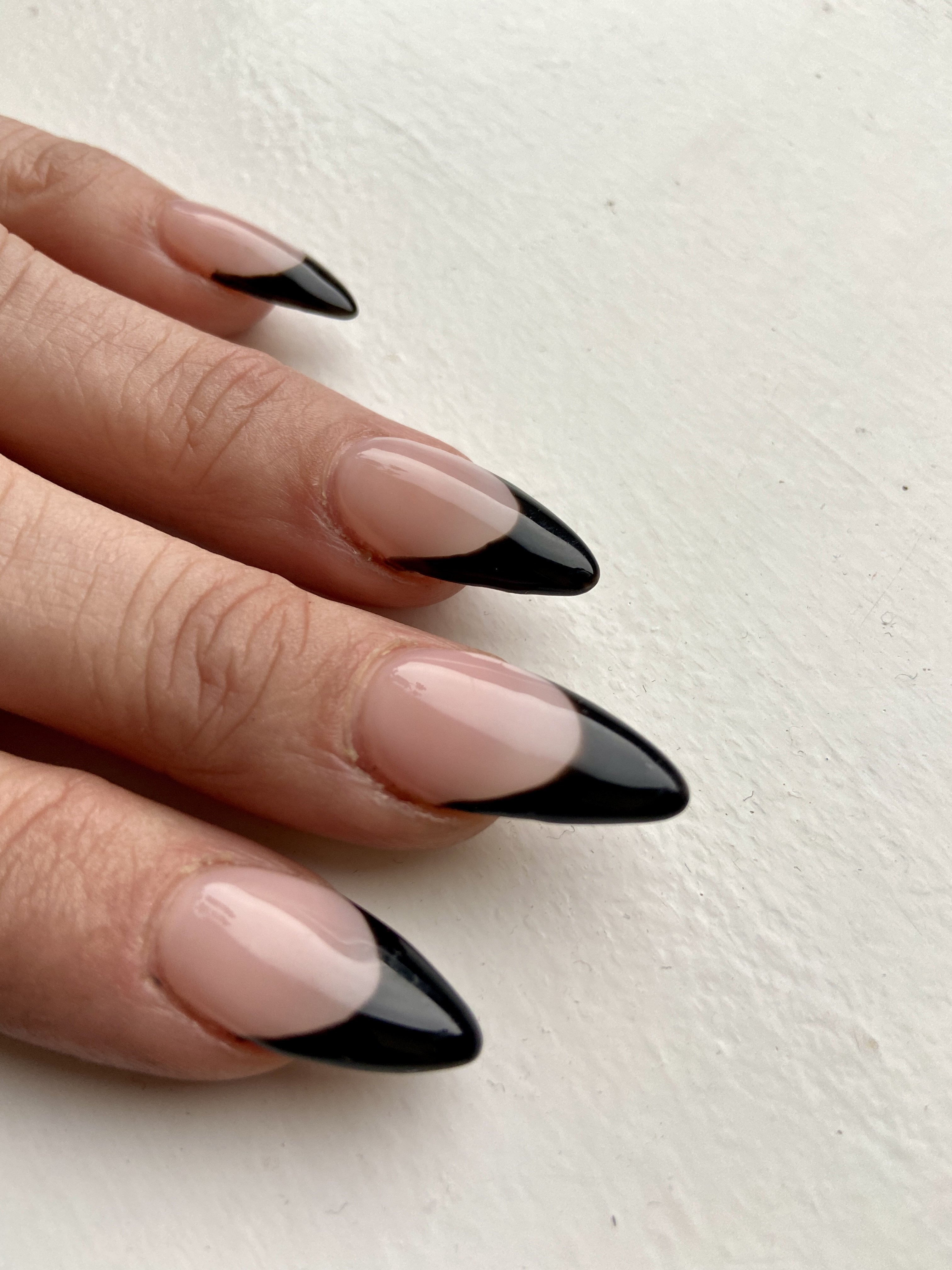 Black French tip manicure. | Source: Getty Images