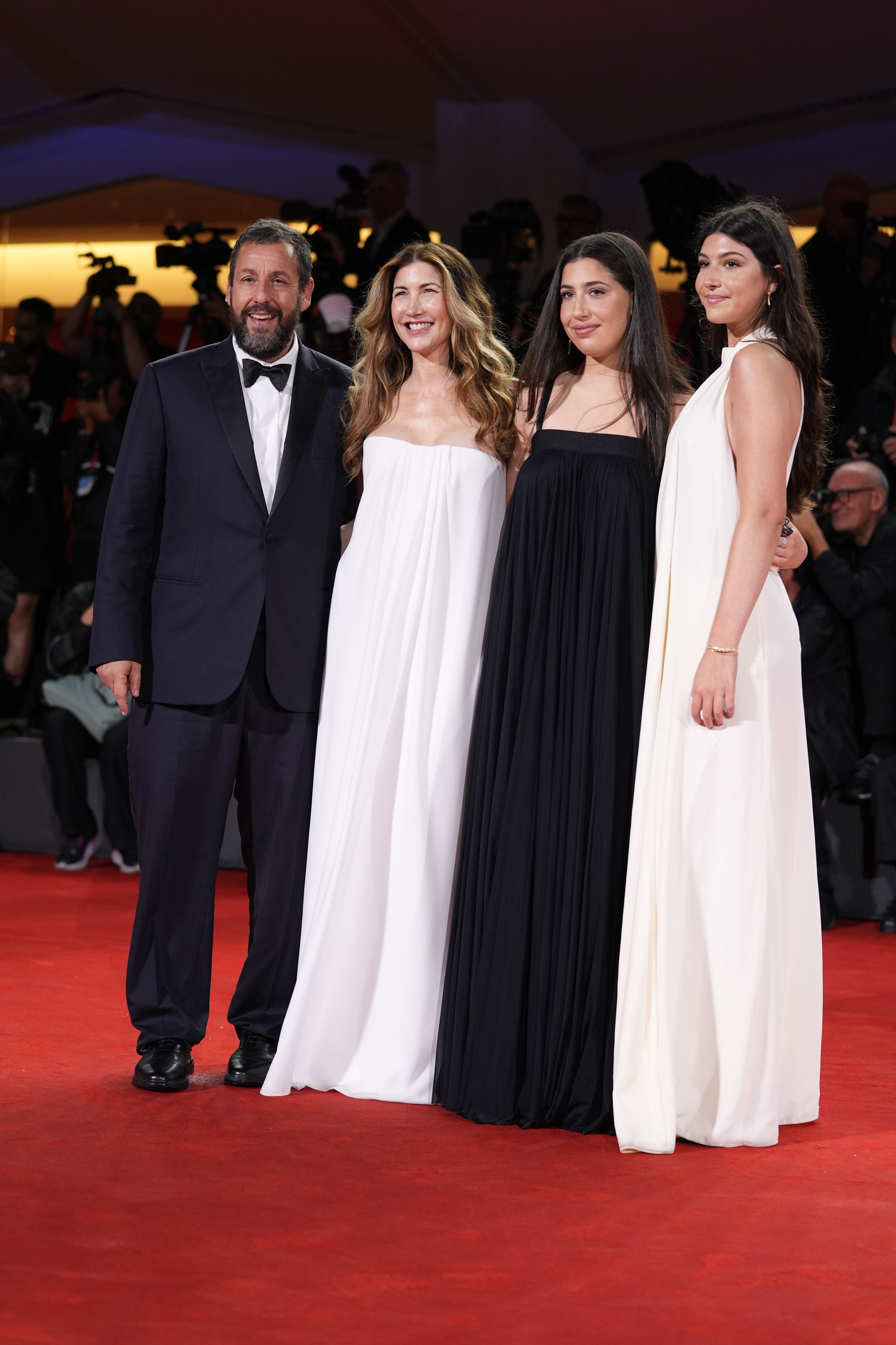 Adam, Jackie Sandler, Sadie, and Sunny Sandler attend the "Jay Kelly" red carpet during the 82nd Venice International Film Festival on August 28, 2025, in Italy | Source: Getty Images