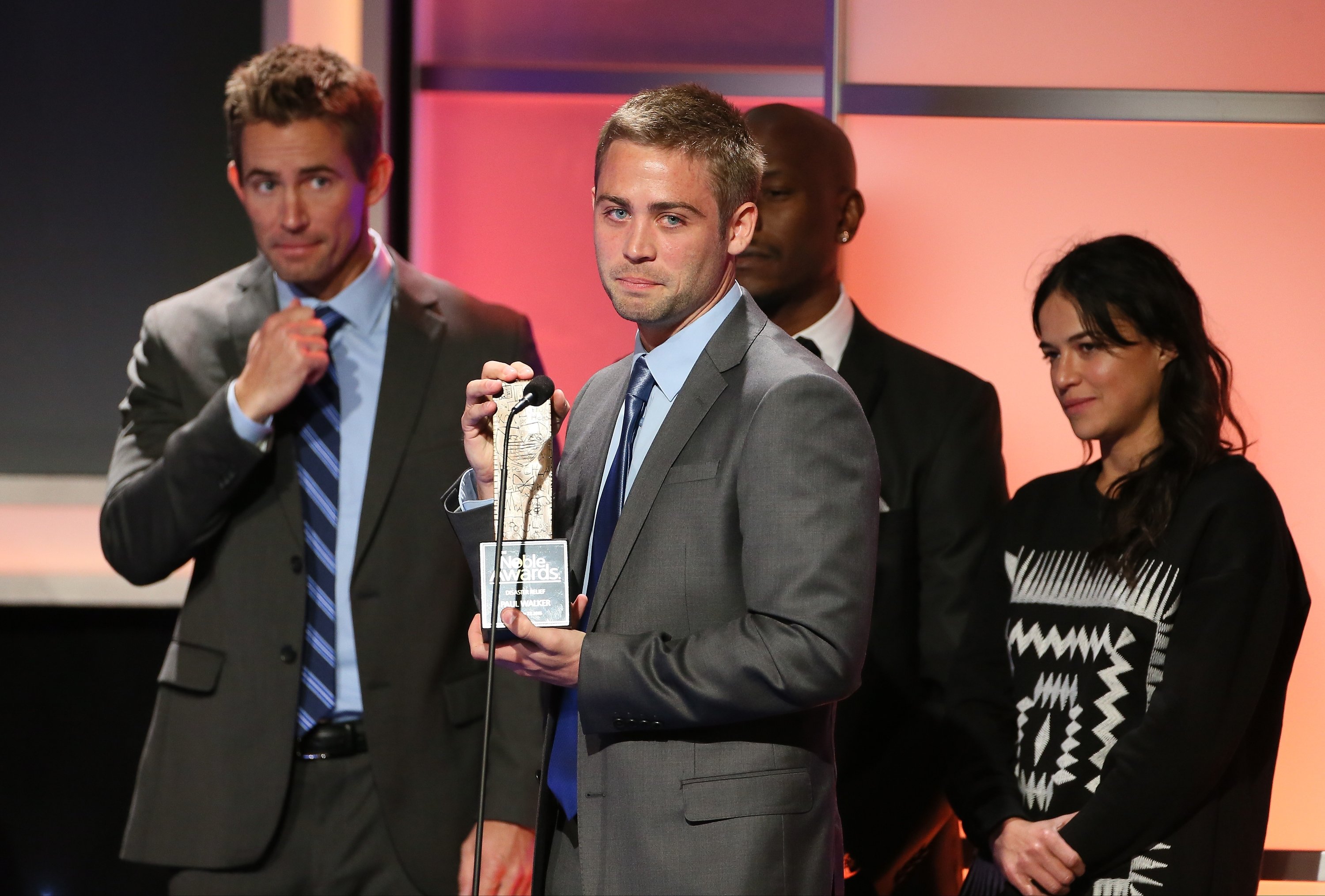Michelle Rodriguez, Cody Walker, Caleb Walker and Tyrese Gibson on stage during the 3rd Annual Noble Awards on February 27, 2015 in Beverly Hills. | Source: Getty Images