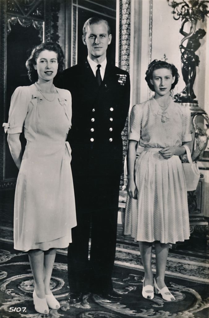 Princess Elizabeth and Princess Margaret with Lieut. Philip Mountbatten', 9 July 1947. | Source: Getty Images
