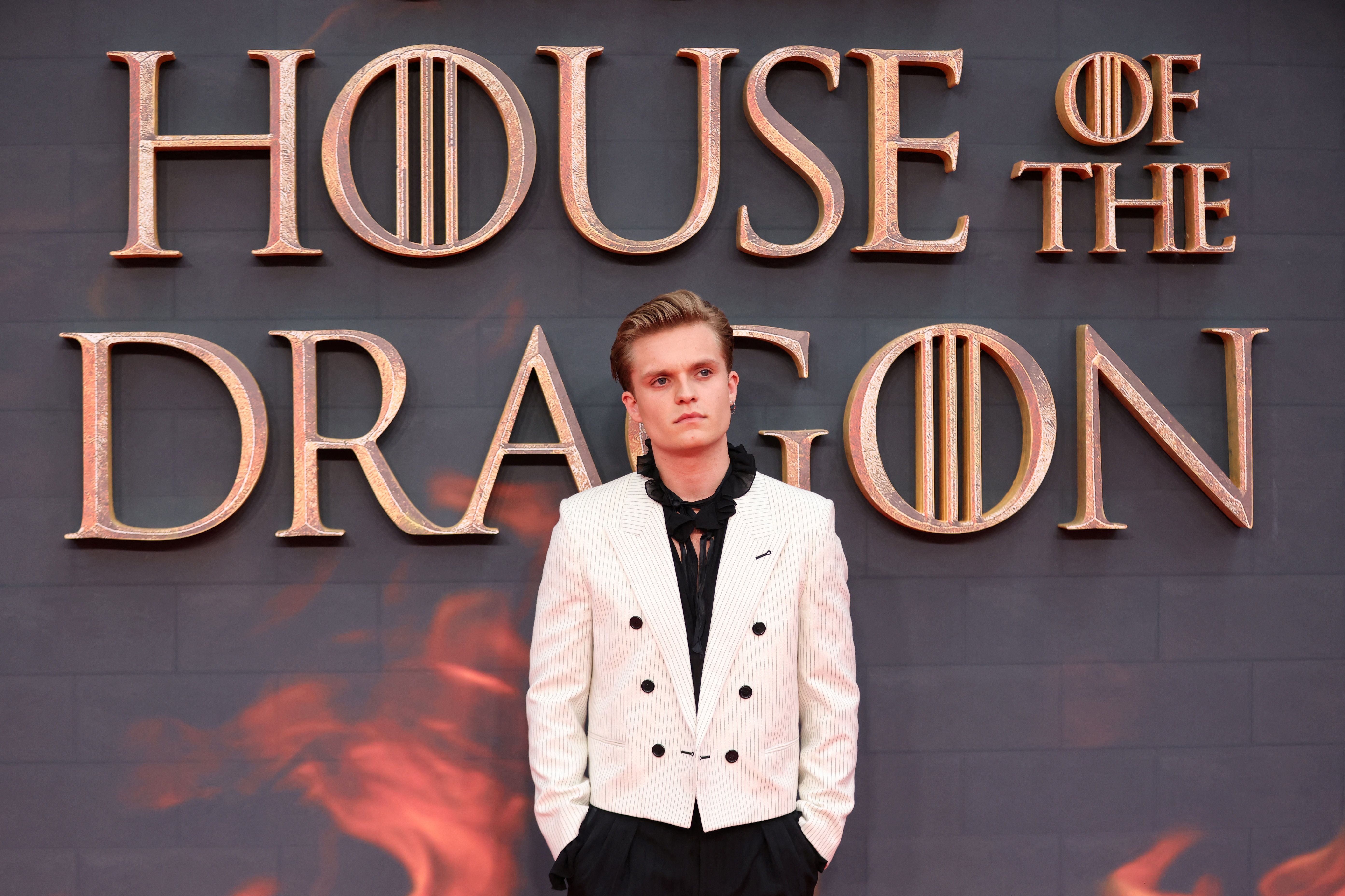 British actor Tom Glynn-Carney poses on the red carpet upon arrival to attend the HBO original drama series "House of the Dragon" premiere at Leicester Square Gardens, in London, on August 15, 2022. | Source: Getty Images