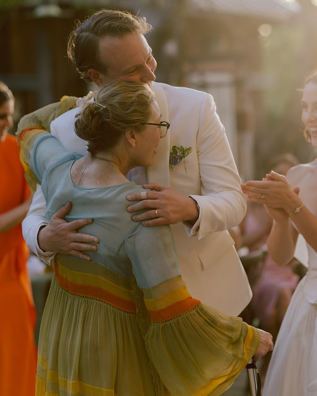 Tatum O'Neal hugging Kevin McEnroe while Fern Cozine applauds beside them, from a post dated July 20, 2025 | Source: Instagram/tatum__oneal