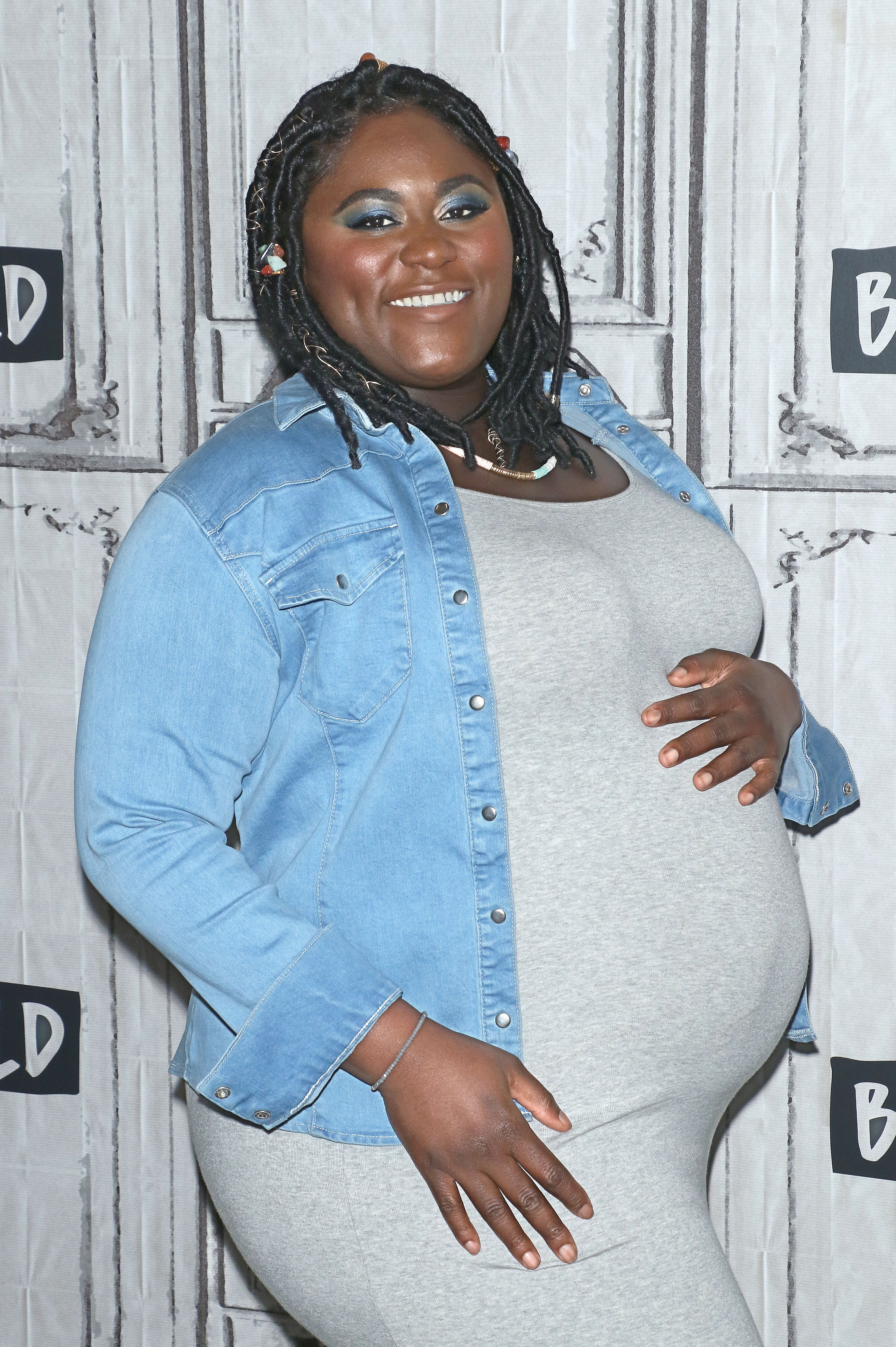 Danielle Brooks flaunting her baby bump at an event | Source: Getty Images/GlobalImagesUkraine