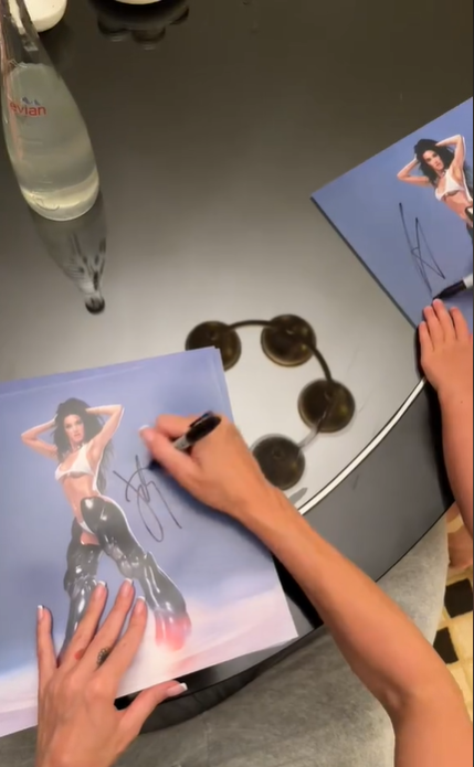 Daisy Dove Bloom seemingly scribbles on Katy Perry's promotional photos with playful doodles, posted in August 2024 | Source: TikTok/katyperry