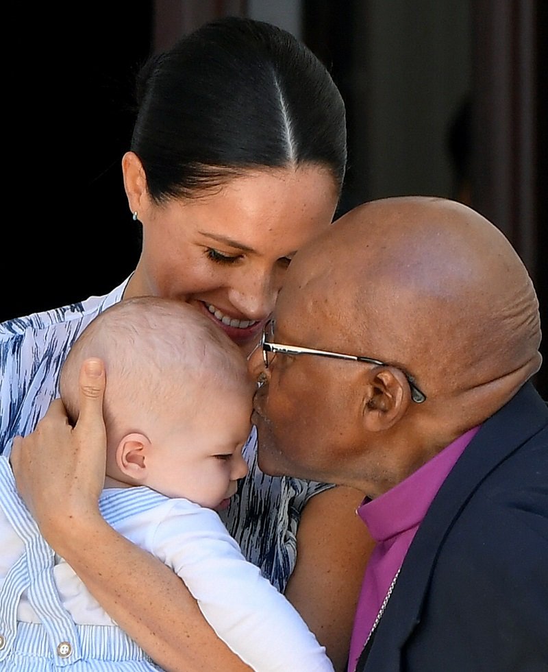 Archbishop Desmond Tutu, Archie Mountbatten-Windsor, and Meghan, Duchess of Sussex, on September 25, 2019 in Cape Town, South Africa | Photo: Getty Images