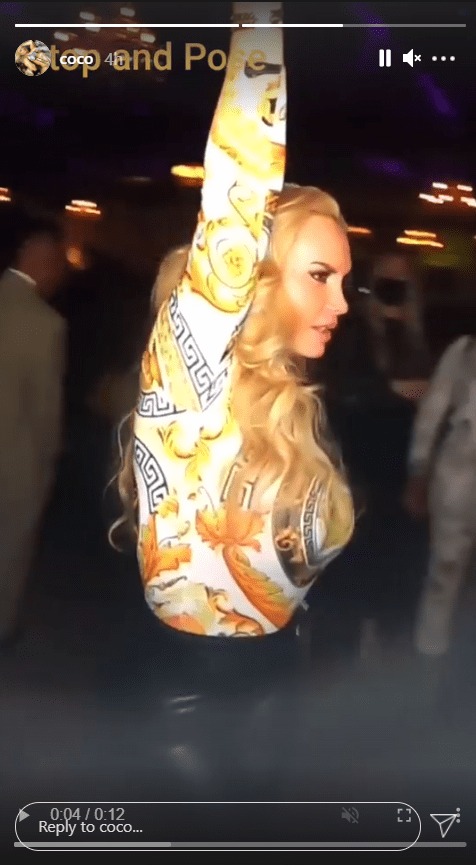 A screenshot from a clip of Coco Austin dancing at the club in her Versace top. | Photo: Instagram.com/Coco