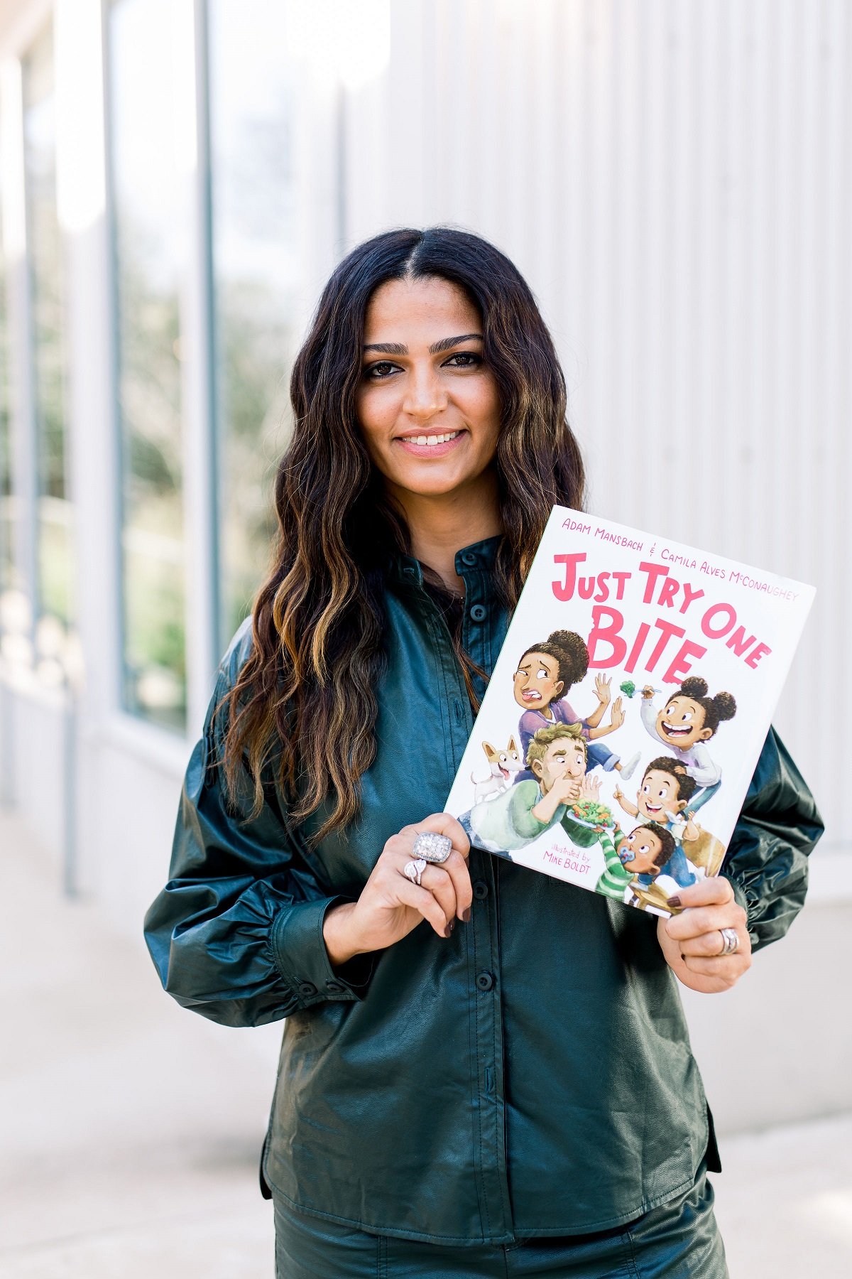 Camila Alves McConaughey holding her book "Just Try One Bite" | Source: Courtesy of Camila Alves McConaughey - Female Founders Collective