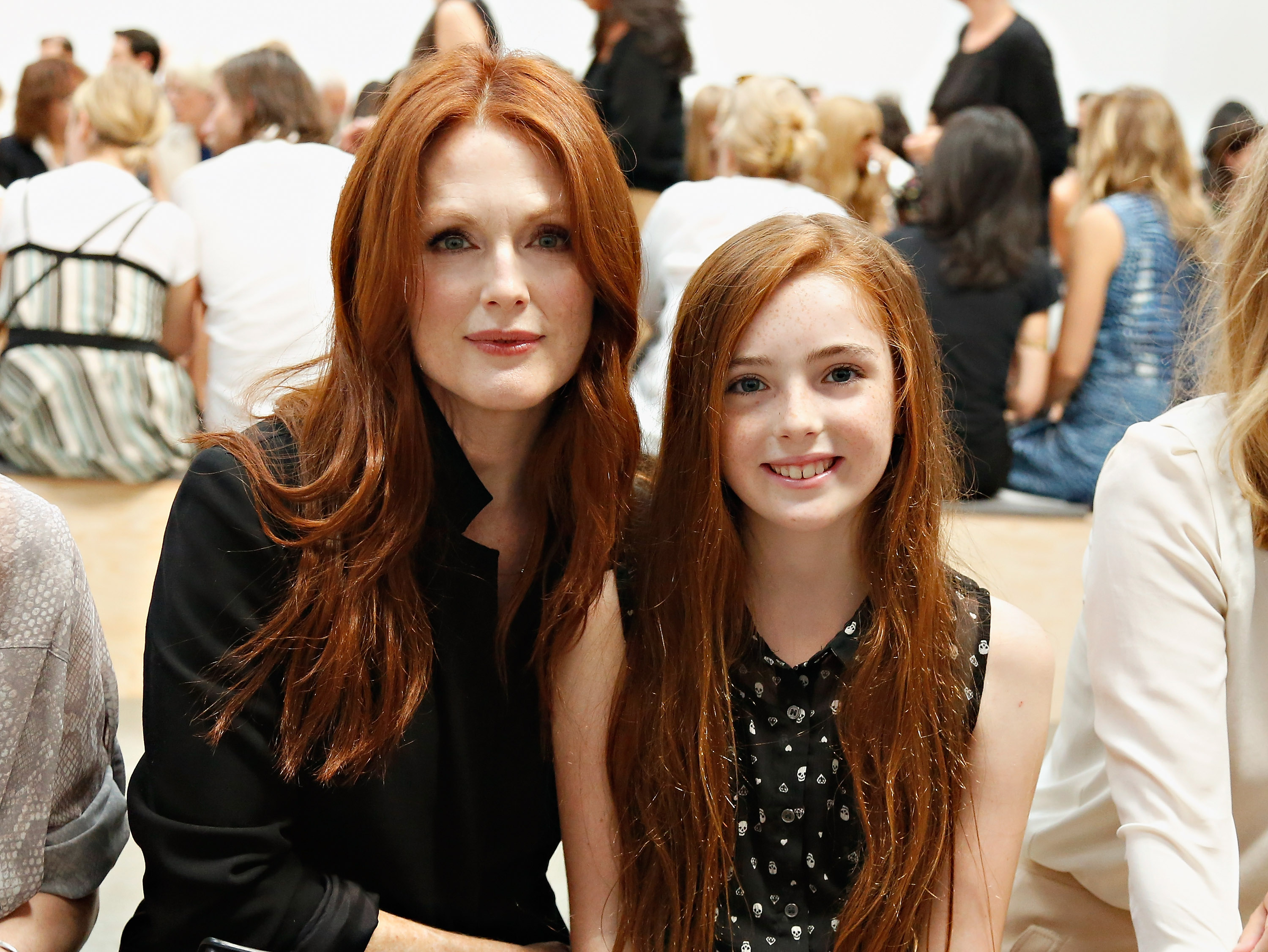 Julianne Moore and Liv Freundlich attend the Reed Krakoff fashion show on September 11, 2013 | Source: Getty Images