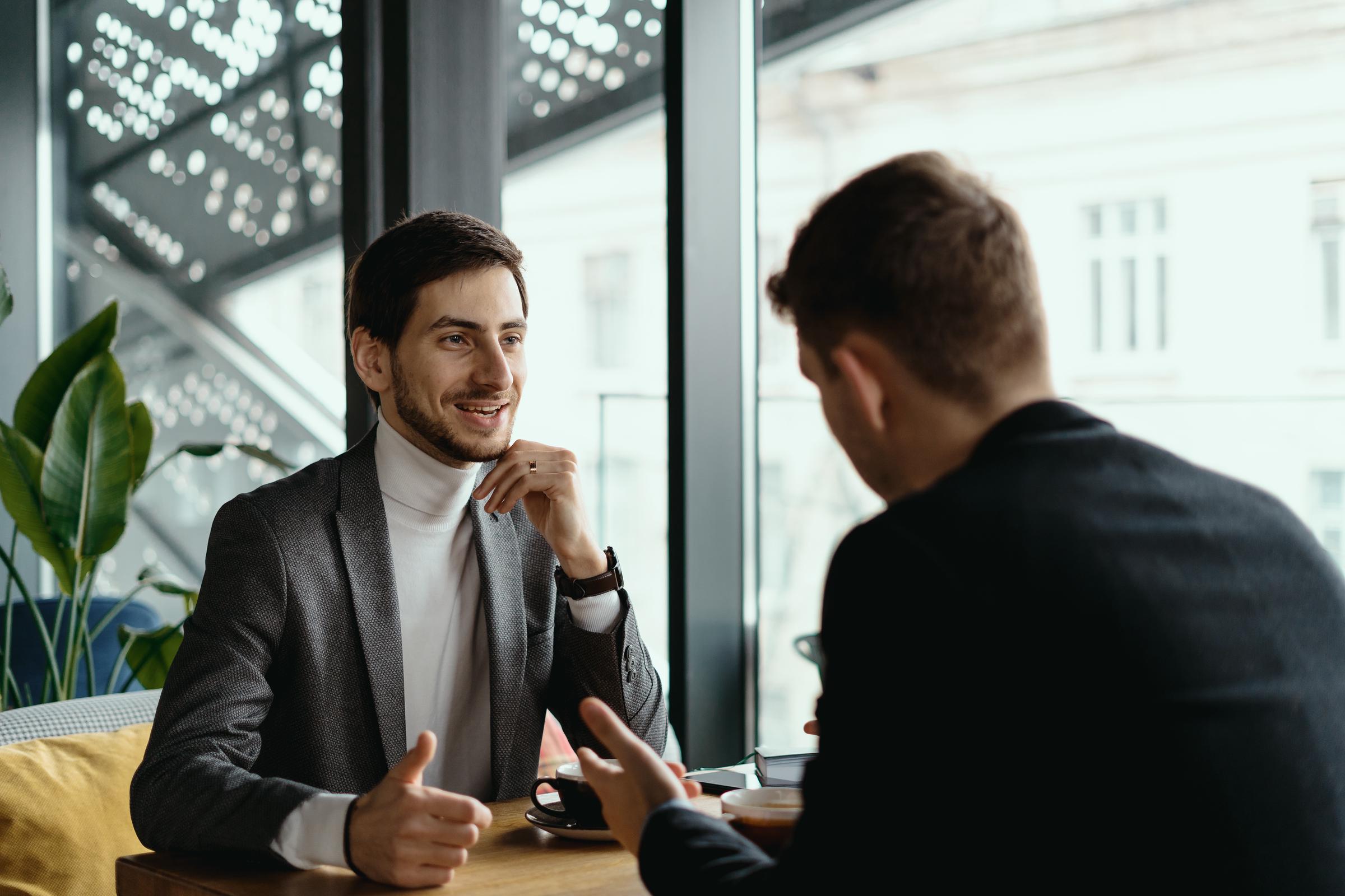 Two men talking | Source: Freepik