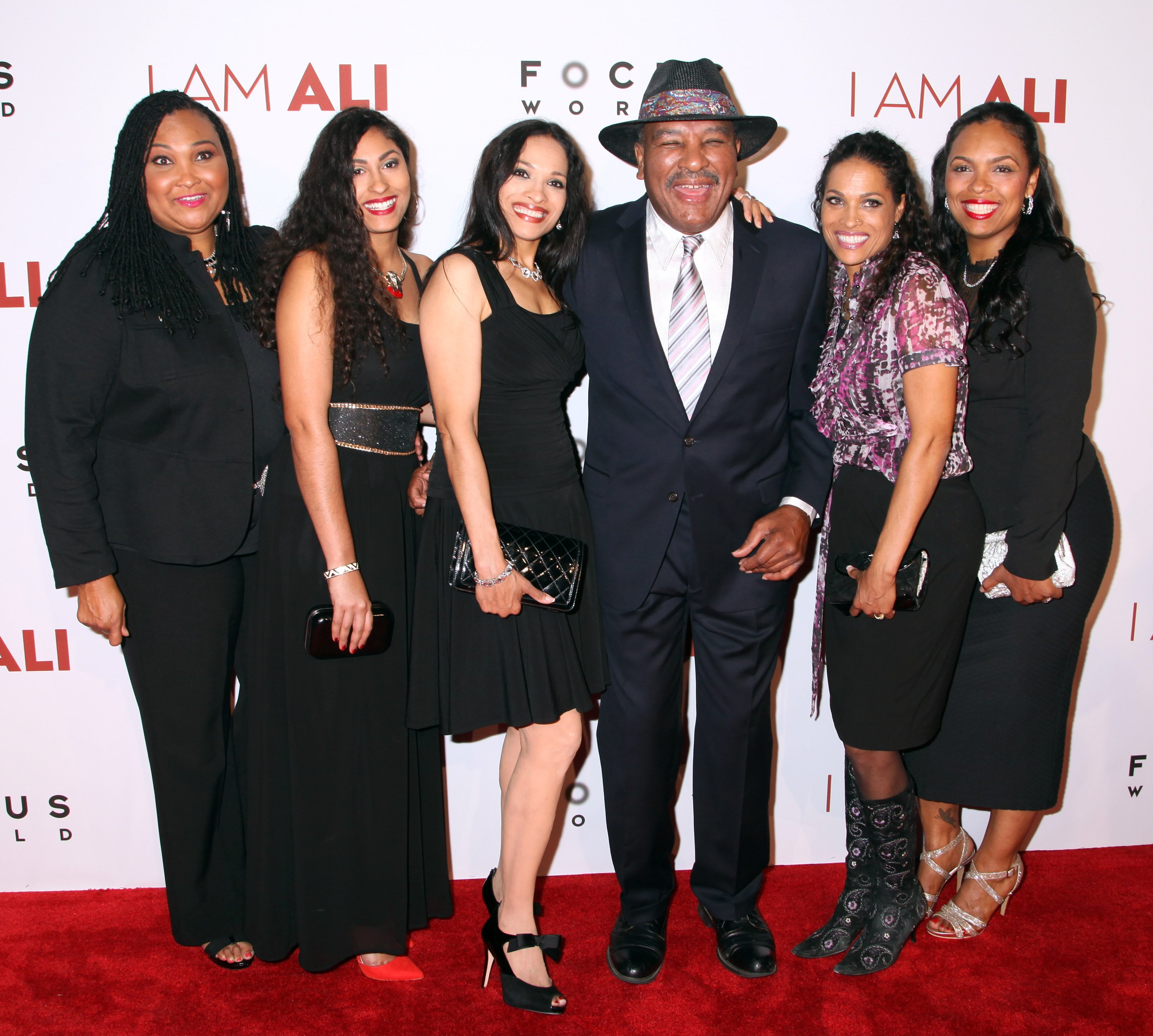 Maryum Ali, Guest, Rasheda Ali-Walsh, Rahman Ali, Jamillah Ali-Joyce and Hana Ali pose on the red carpet as they arrive at the Los Angeles premiere of Focus World's "I Am Ali" at ArcLight Hollywood on October 8, 2014, in Hollywood | Source: Getty Images