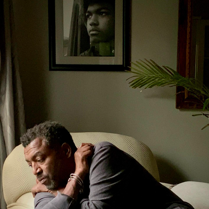 Russell Andrews sitting on a coach looking contemplative, posted on March 6, 2021. | Source: Instagram/a.russellandrews