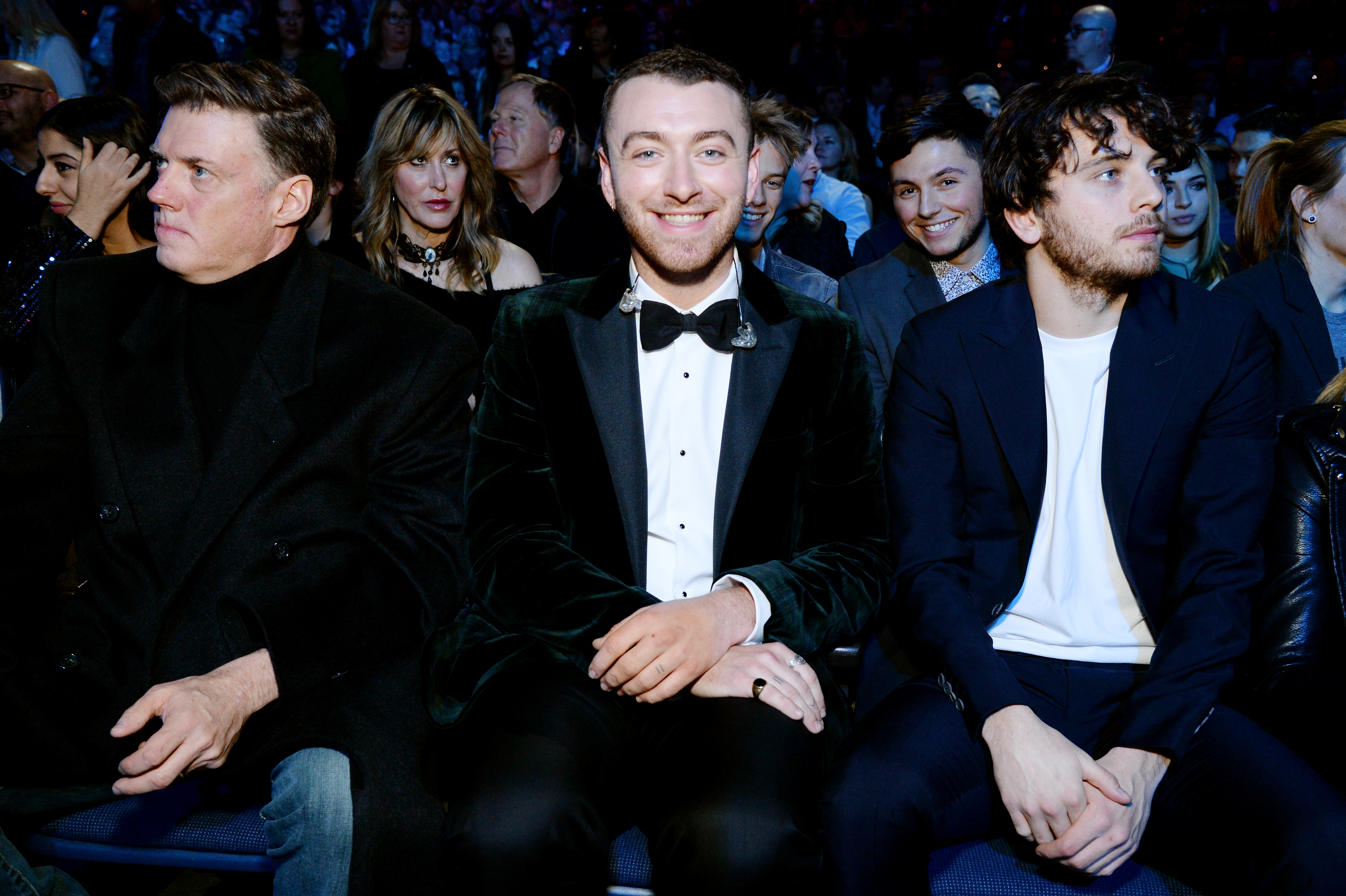 Sam Smith (C) and Brandon Flynn (R) at the 60th Annual GRAMMY Awards on January 30, 2018, in New York. | Source: Getty Images