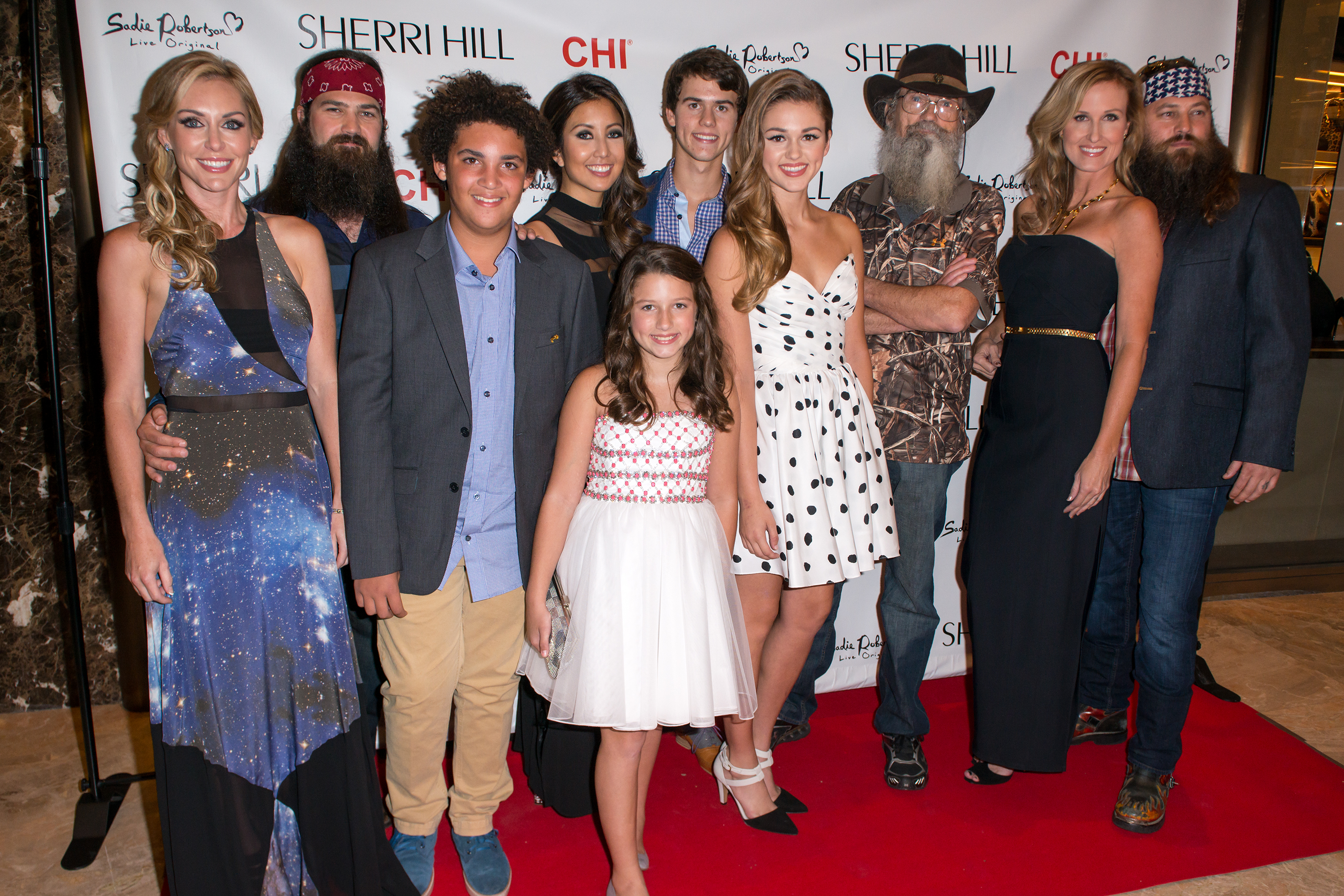 Jessica, Jep, Will, Rebecca, Bella, John Luke, Sadie, Silas Merritt "Si", Korie, and Willie Robertson attend the Evening By Sherri Hill Spring show in New York City, on September 9, 2013 | Source: Getty Images