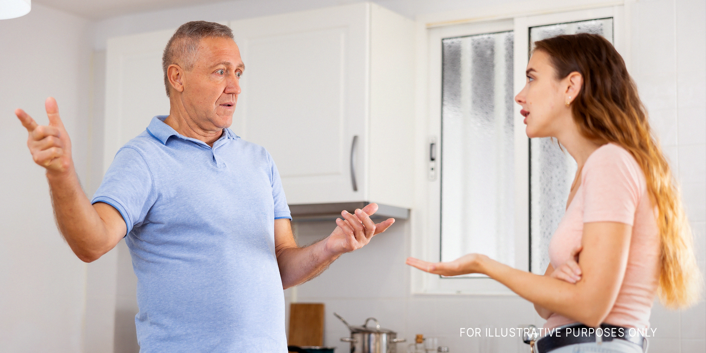 A father and daughter are seen arguing in the kitchen area | Source: Shutterstock