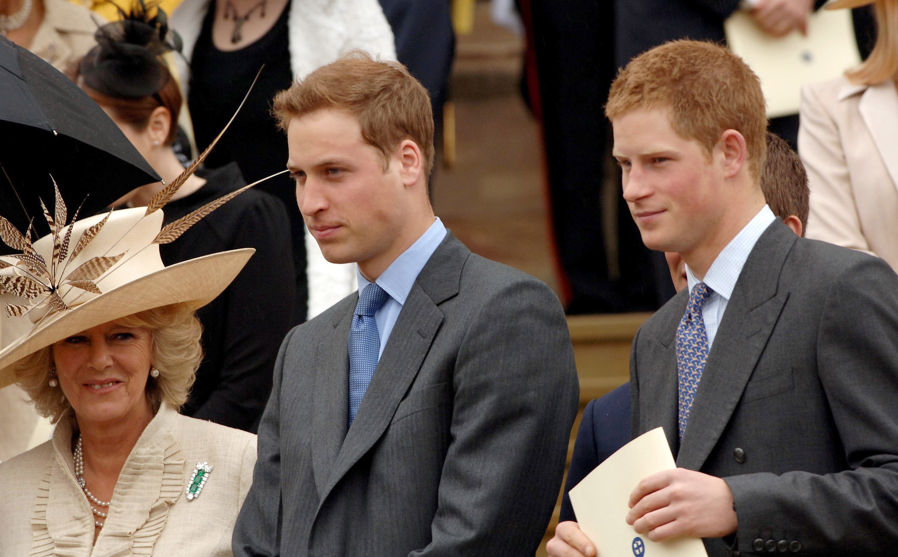 Camilla Parker Bowles, Duchess of Cornwall, Prince William and Prince Harry stand on the steps of St. George's Chapel, Windsor, following the Service of Thanksgiving for the Queen's 80th birthday on April 23, 2006 | Source: Getty Images