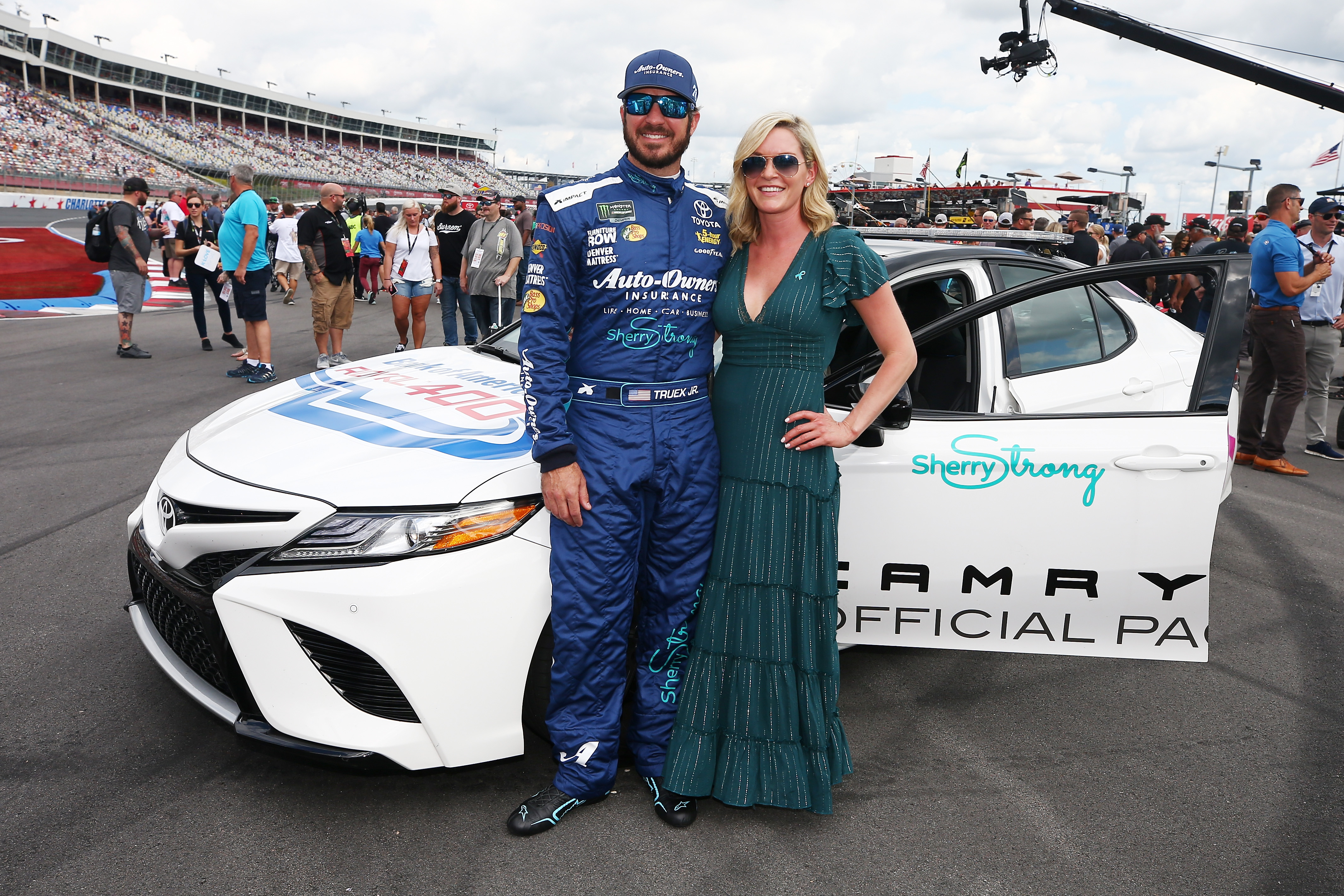 Martin Lee Truex Jr. and Sherry Pollex at the Monster Energy NASCAR Cup Series Bank of America Roval 400 on September 30, 2018, in Charlotte | Source: Getty Images