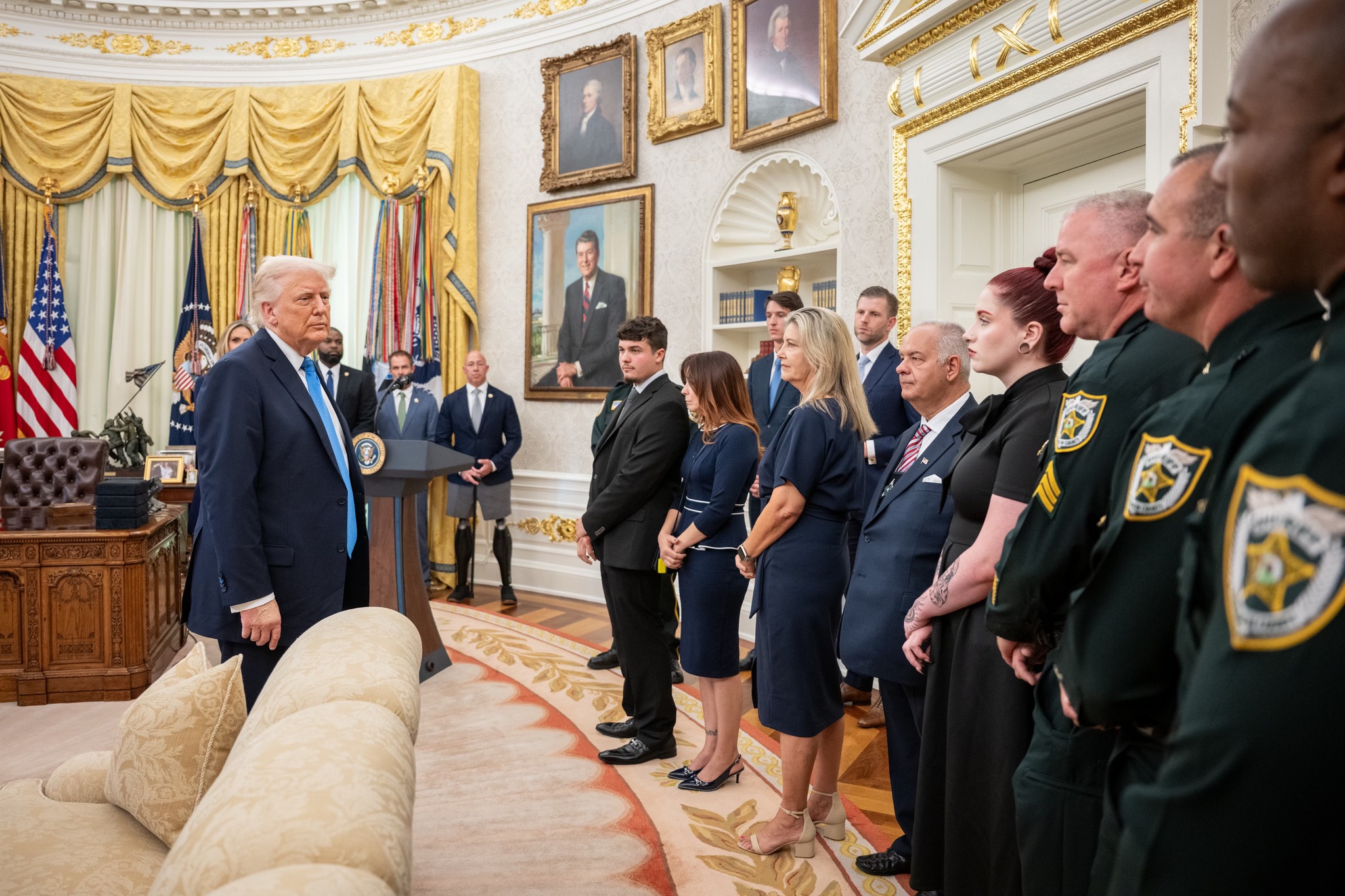 President Donald Trump with the families of the fallen officers, from a post dated May 20, 2025 | Source: Facebook/WhiteHouse