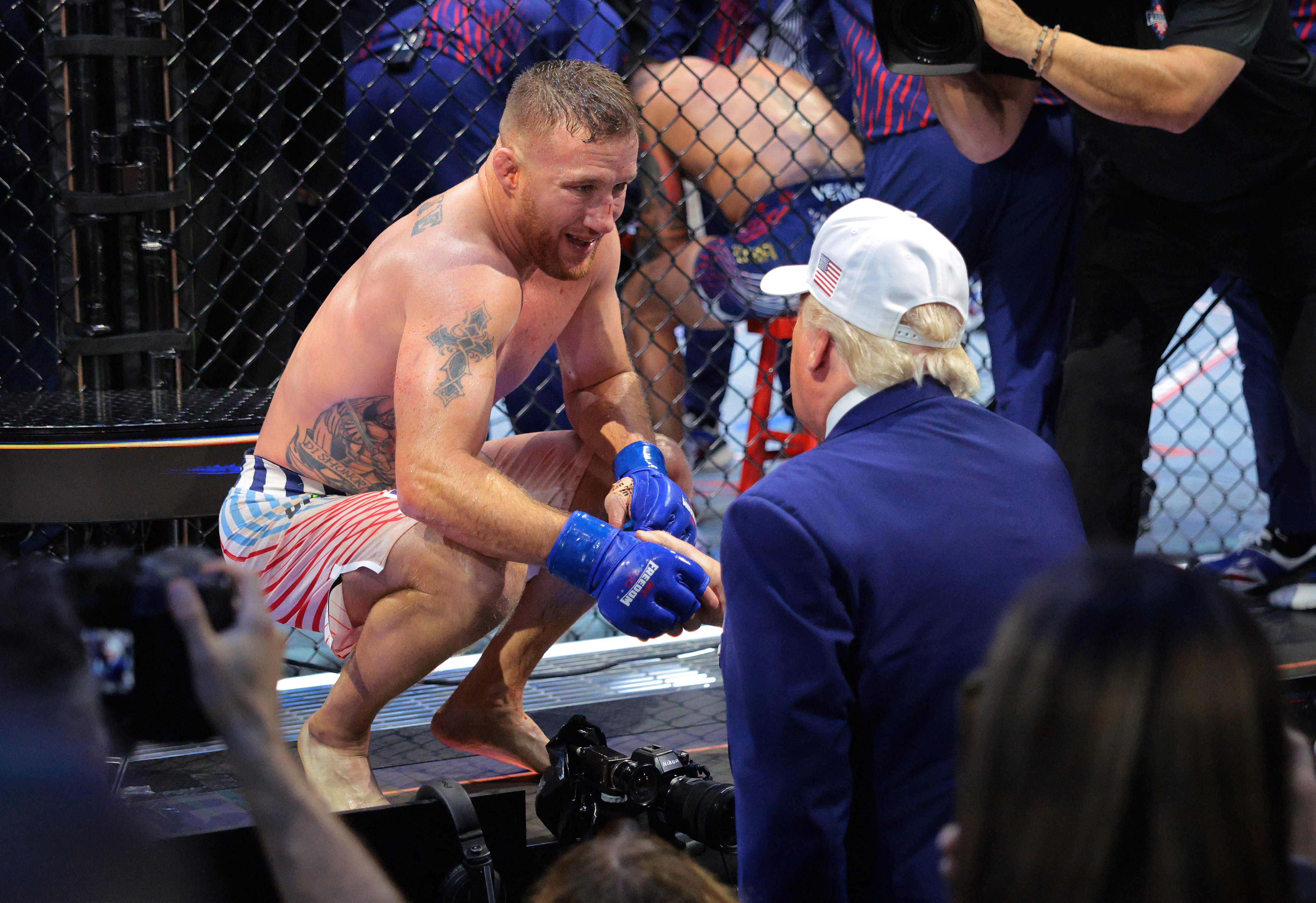 Justin Gaethje and Donald Trump share a moment following a bout at UFC Freedom 250 on the White House South Lawn. | Source: Getty Images