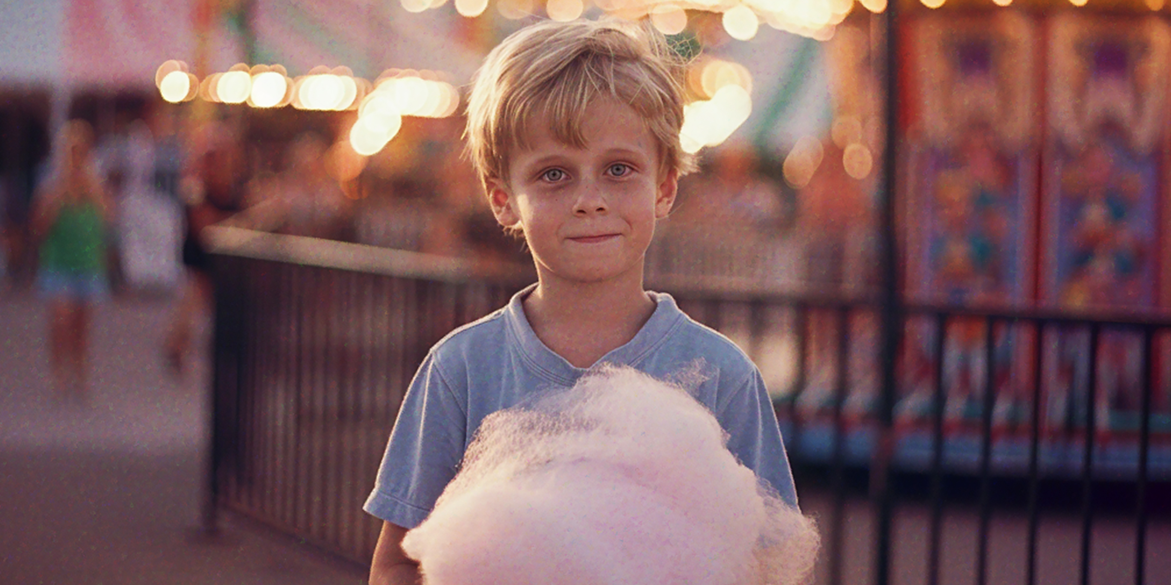 Boy with cotton candy | Source: Amomama