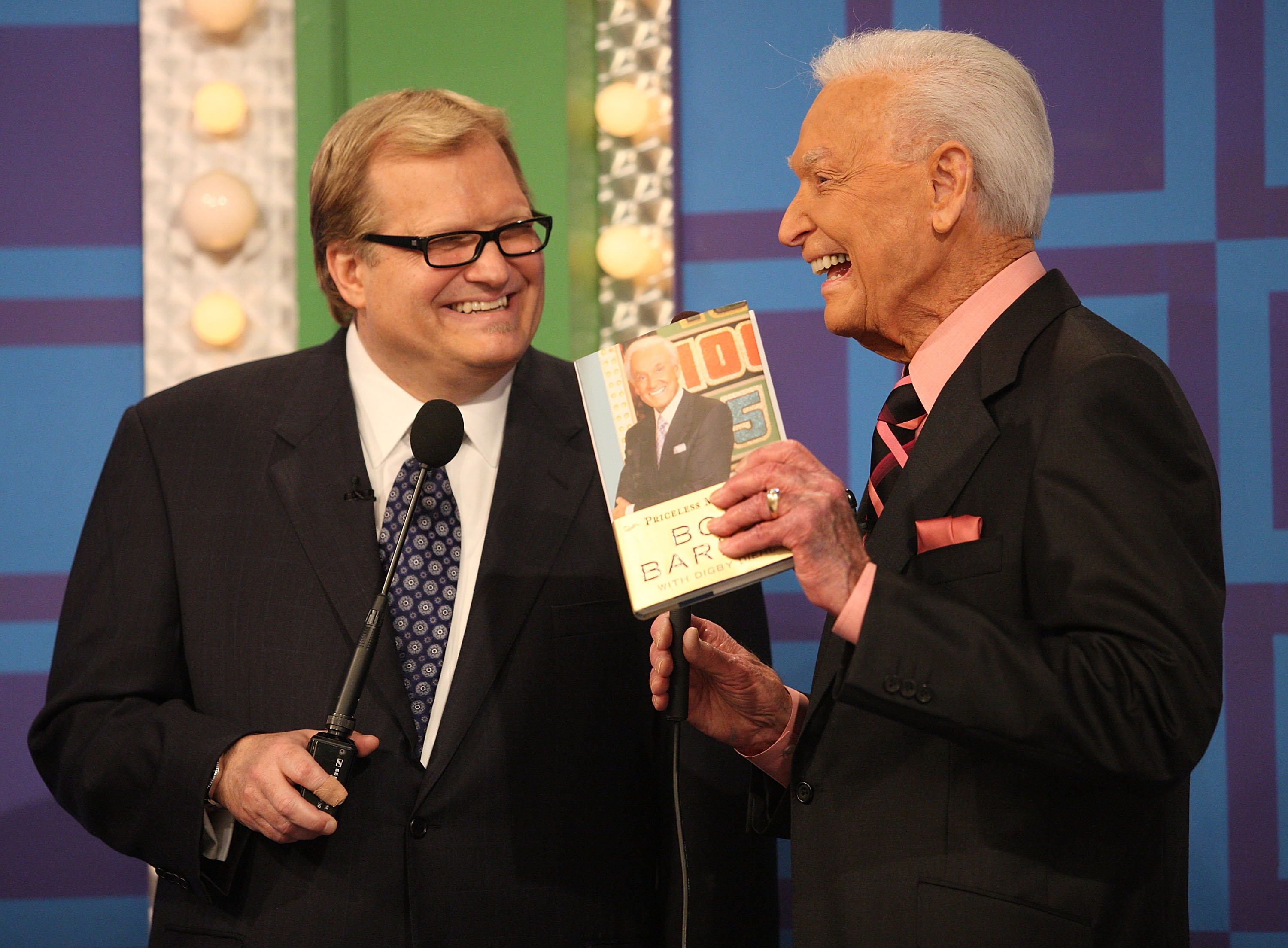 Host Drew Carey and former host Bob Barker speak during a segment of "The Price Is Right" at CBS Television City, on March 25, 2009, in Los Angeles, California. | Source: Getty Images