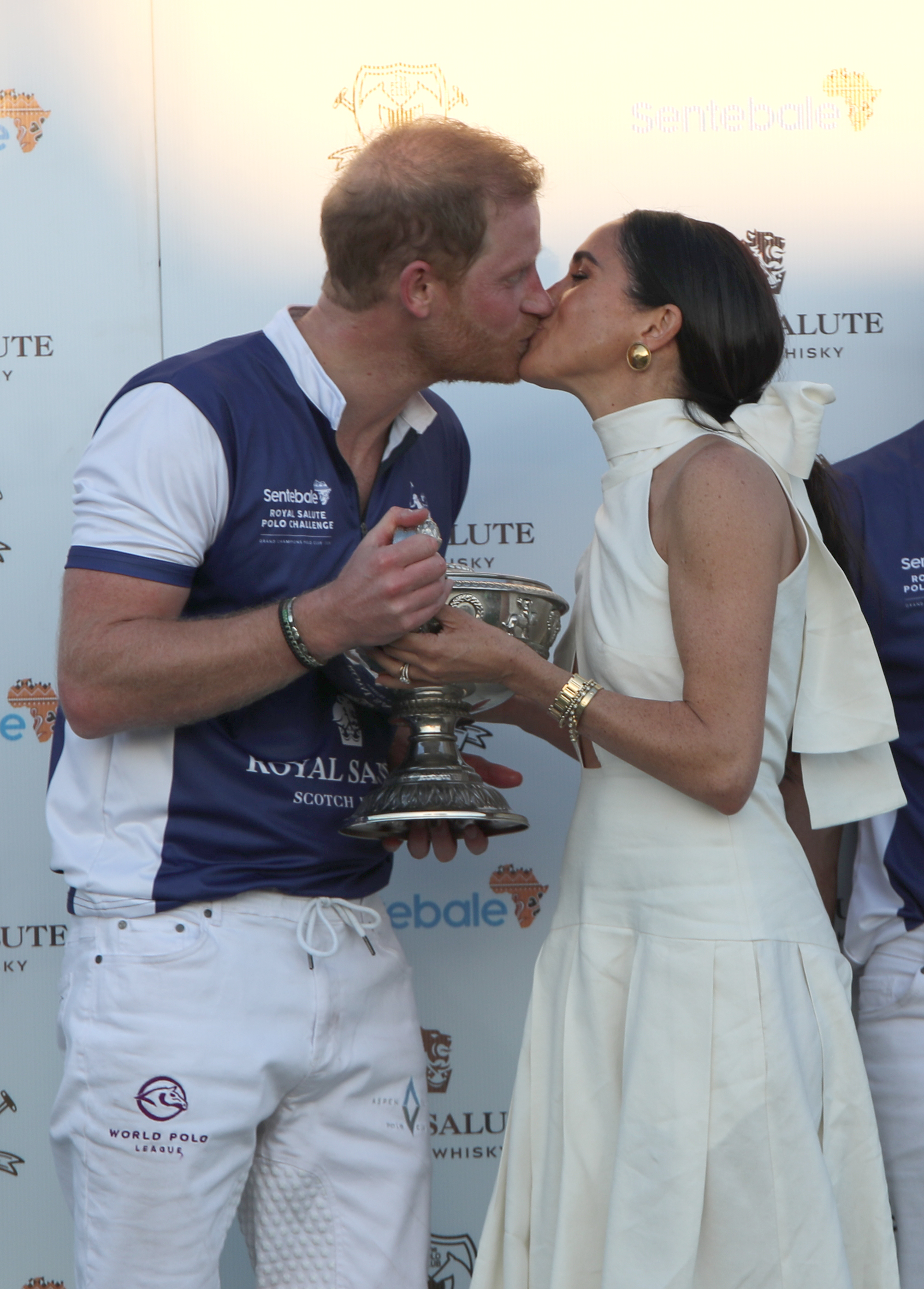 Meghan Markle, Duchess of Sussex presents the trophy to Prince Harry, The Duke of Sussex after his team wins, in the Royal Salute Polo Challenge, to benefit Sentebale, in Wellington, Florida, on April 12, 2024. | Source: Getty Images