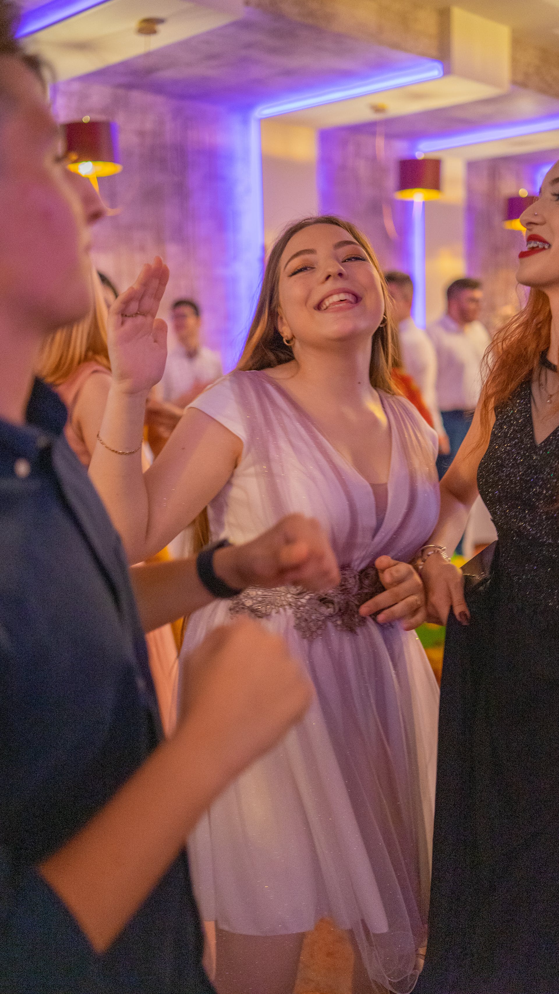 A woman dancing at a wedding reception | Source: Pexels
